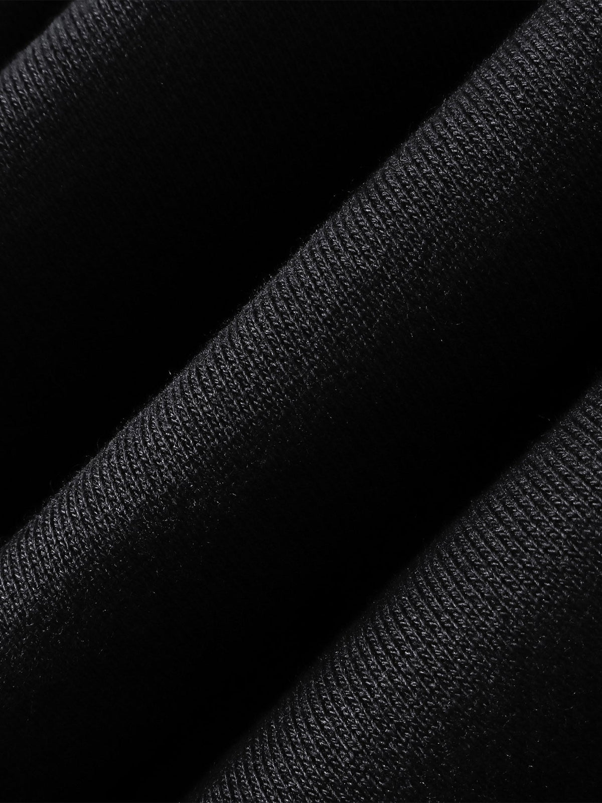 Close-up of the Grey Blue pants embroidered leather panel.