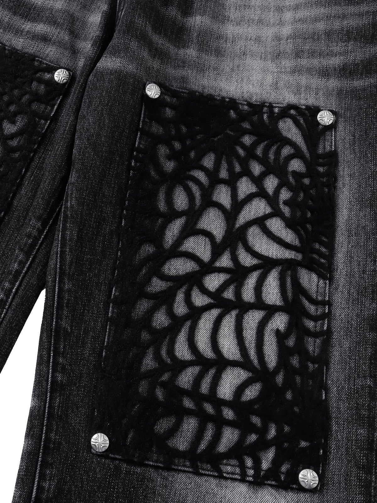 TBHNP T260017 black jeans, layered cobweb patch with metal accents.