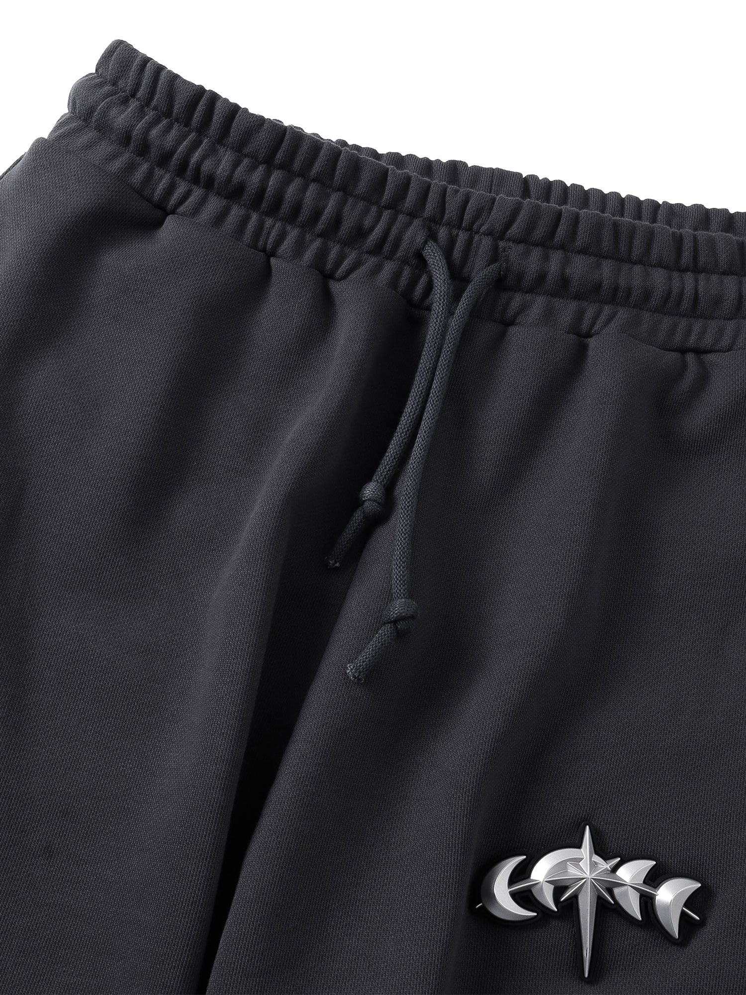 Close-up of the Black pants front construction and French terry texture.