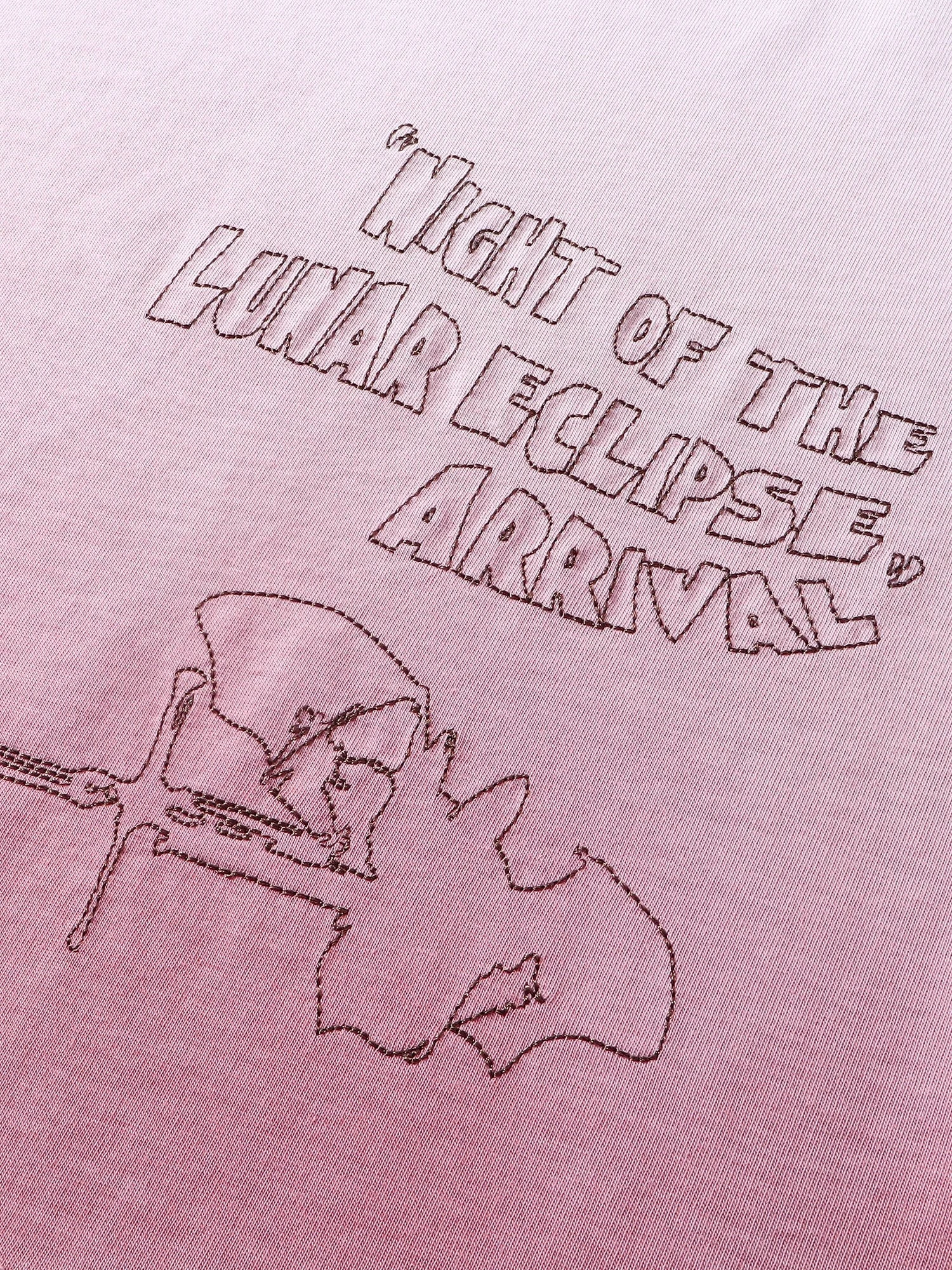 Close-up of the back graphic print on TBHNP white arrival tee — men's streetwear detail