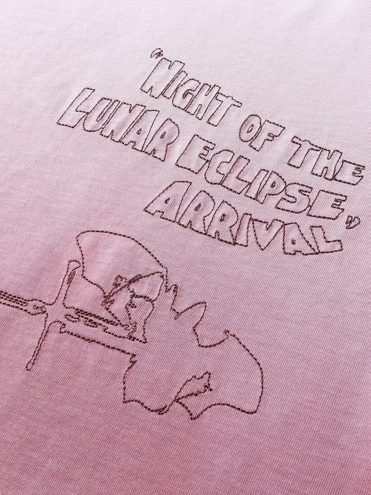 Close-up of the back graphic print on TBHNP white arrival tee — men's streetwear detail