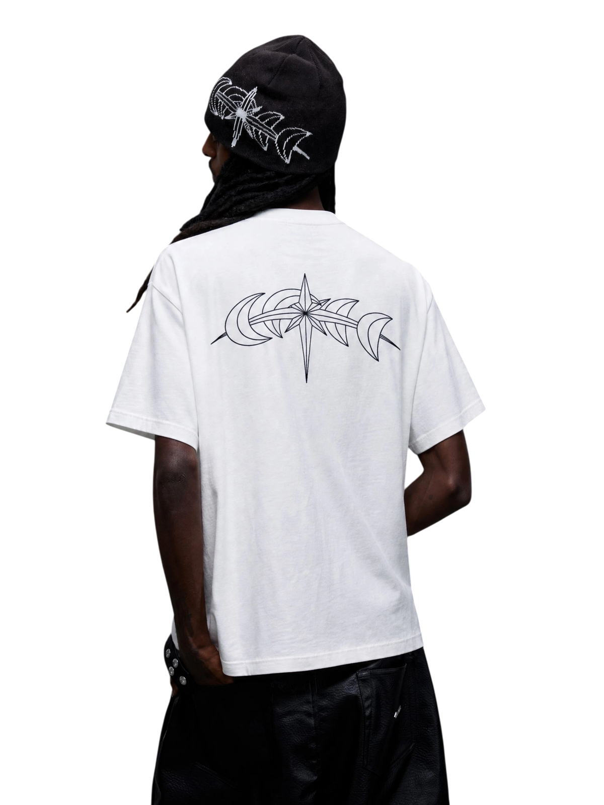 Model wearing the white Luminous Dawn T-shirt with a black astral crescent back graphic