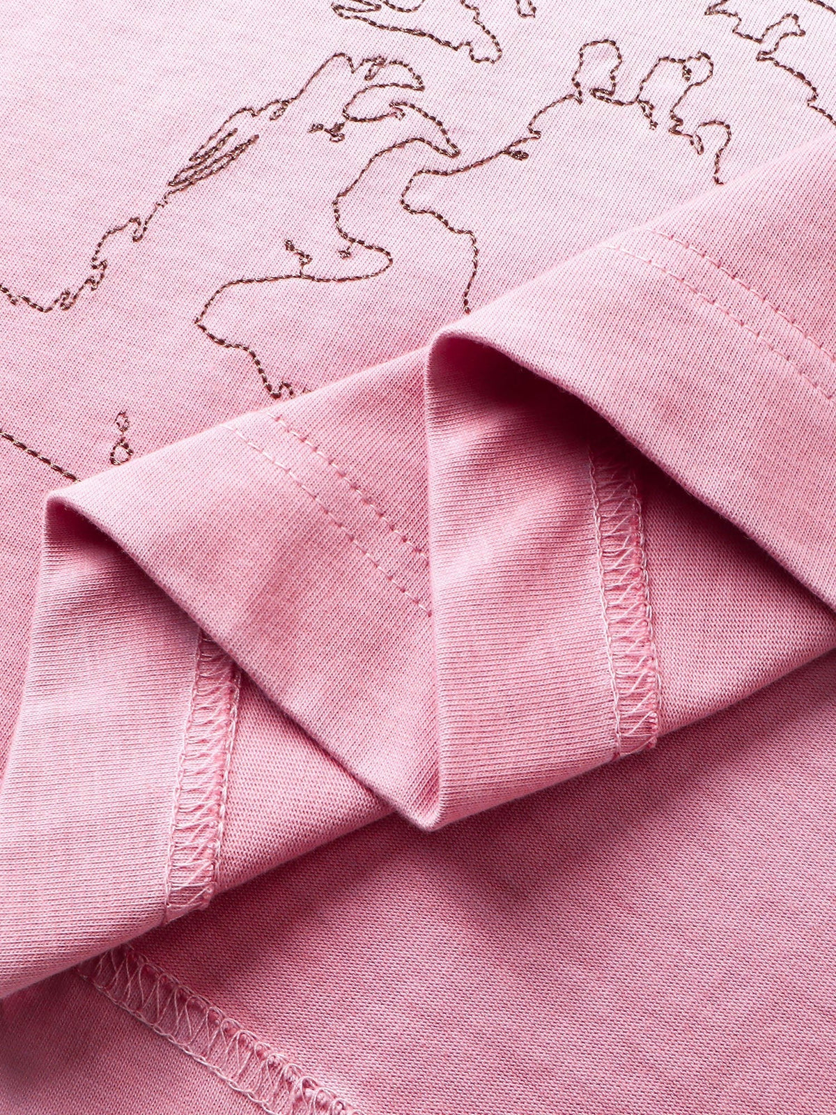 Close-up of the deconstructed sleeve hem on TBHNP white arrival tee — men's streetwear detail