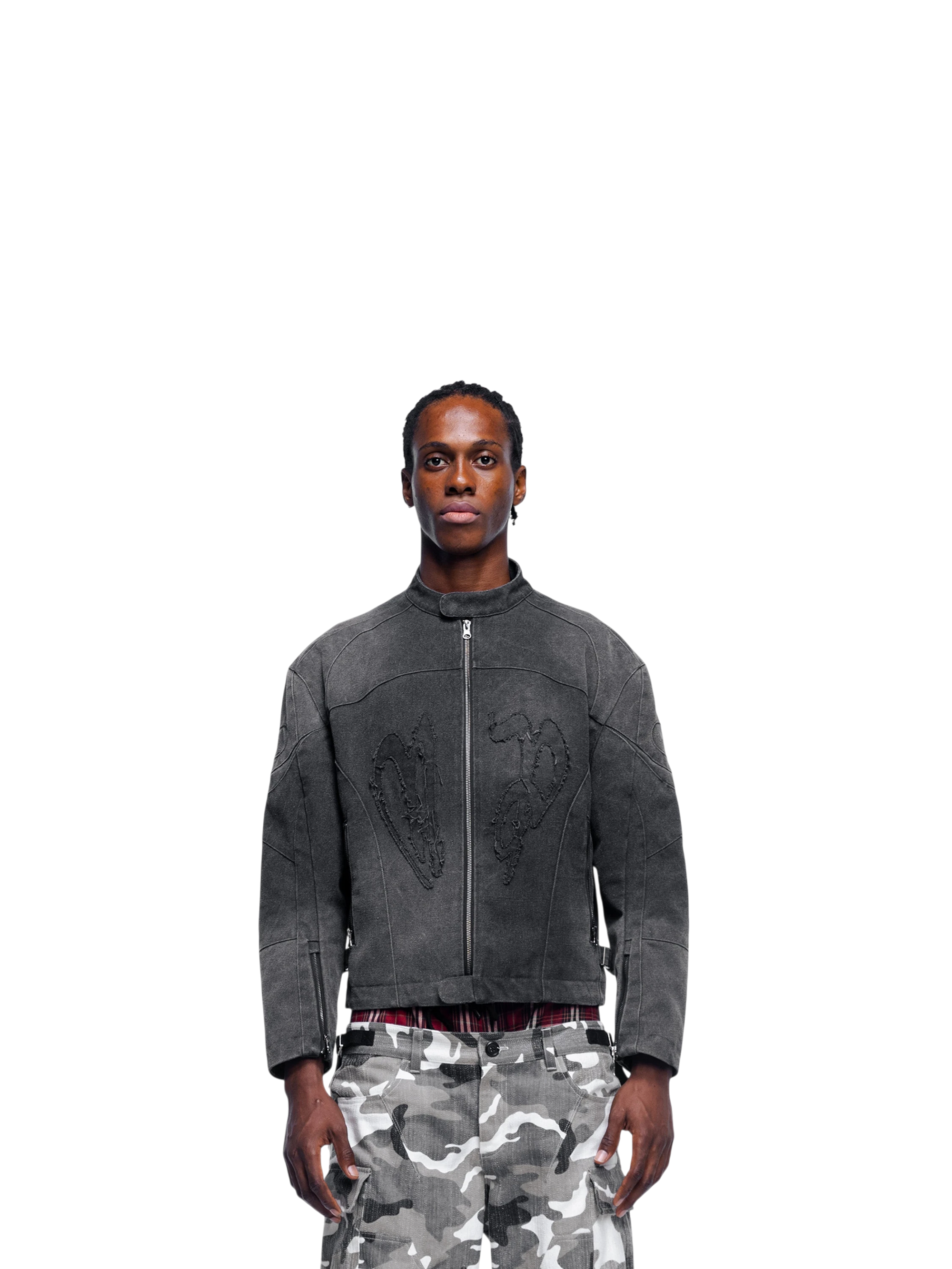 Male model wearing TBHNP black canvas moto jacket, front — men's streetwear jacket