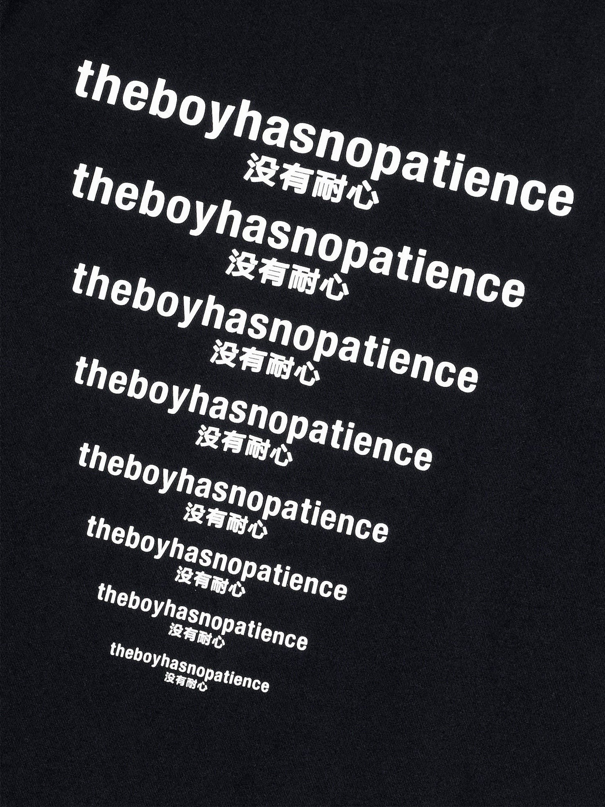 Close-up of white TBHNP and Chinese slogan printing on black cotton