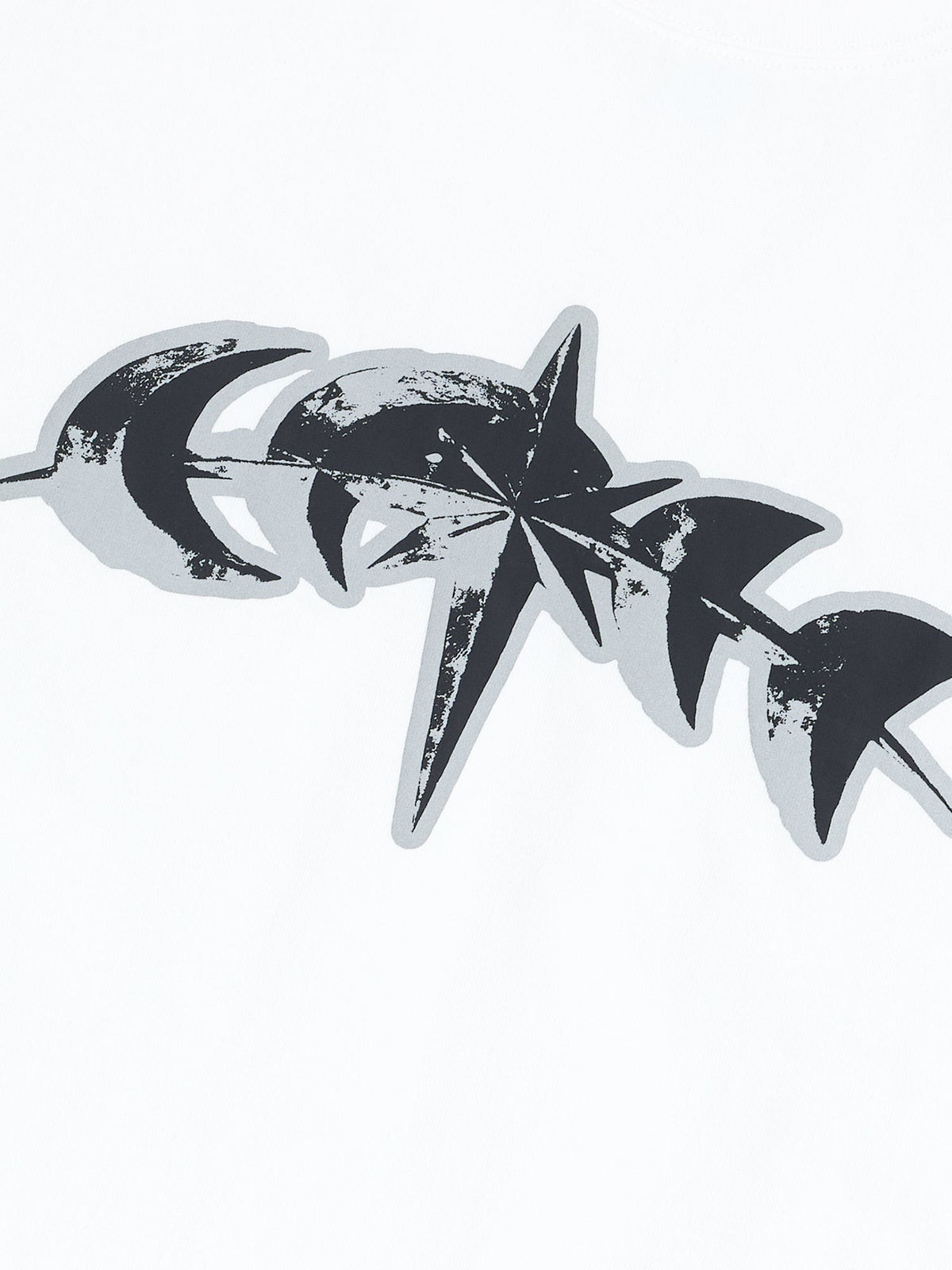 Close-up of the 3M reflective star logo print on white cotton