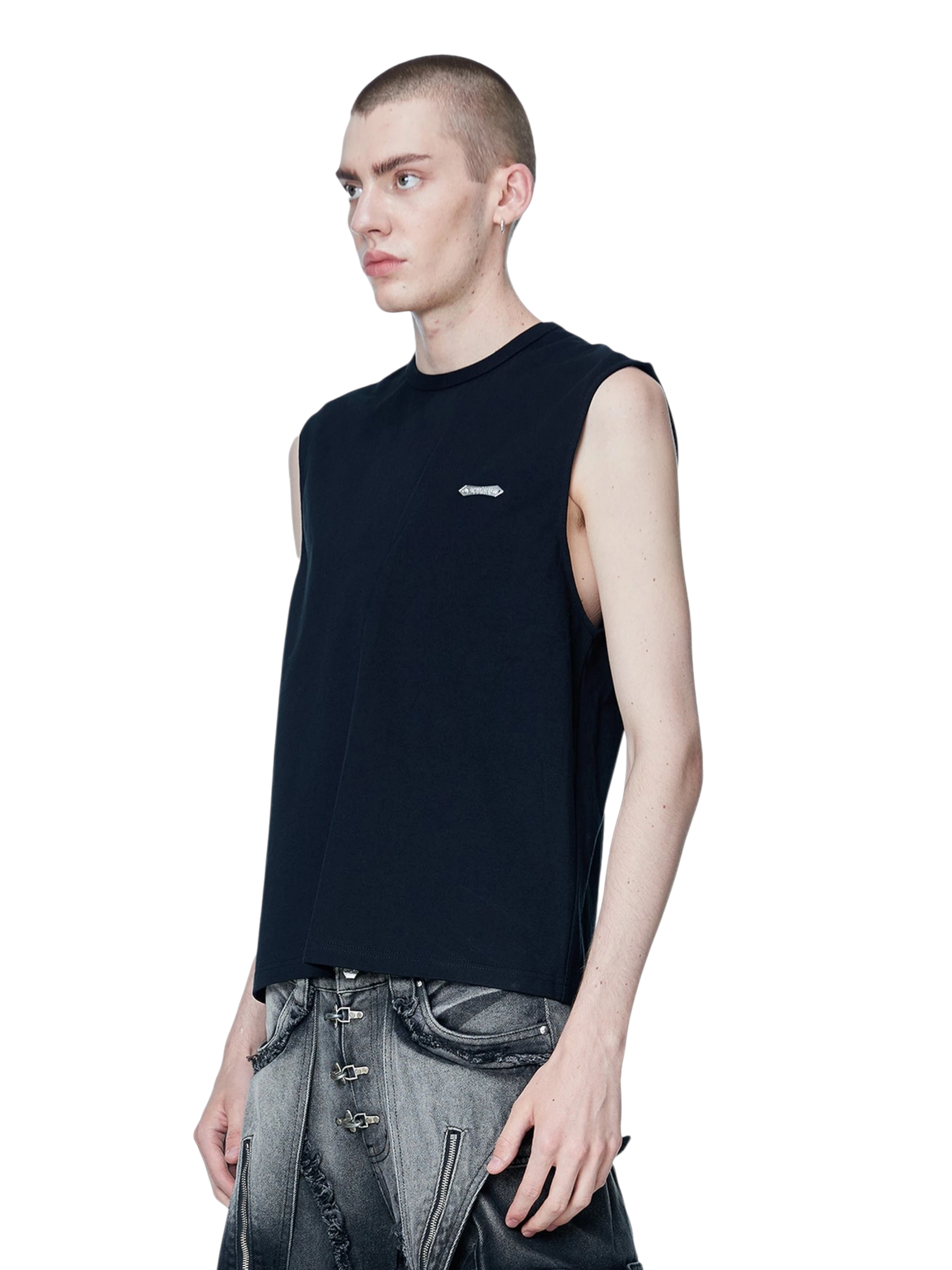 Model styling TBHNP black Shadowbat vest, front detail — men's streetwear sleeveless tee