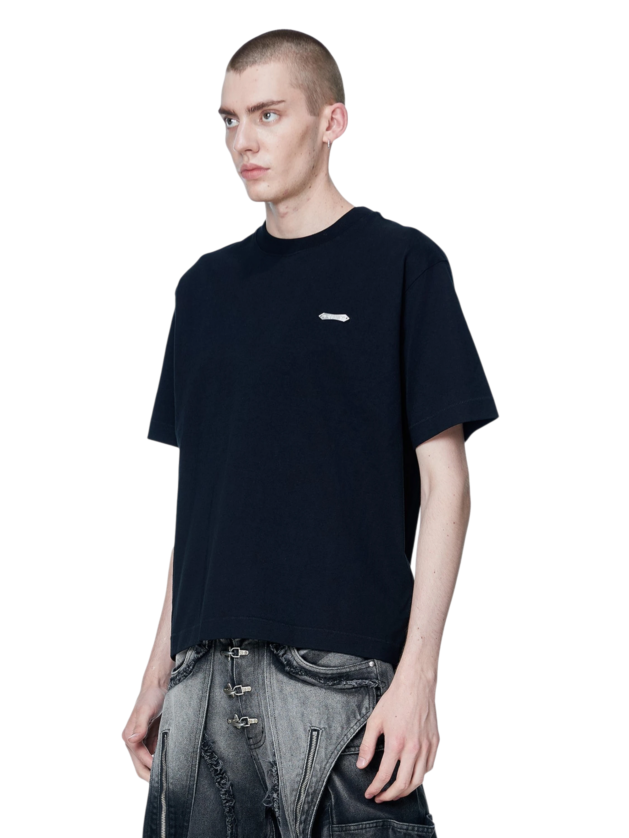 Model wearing TBHNP black Emblem & Shadowbat tee, back view with emblem print — men's streetwear tee