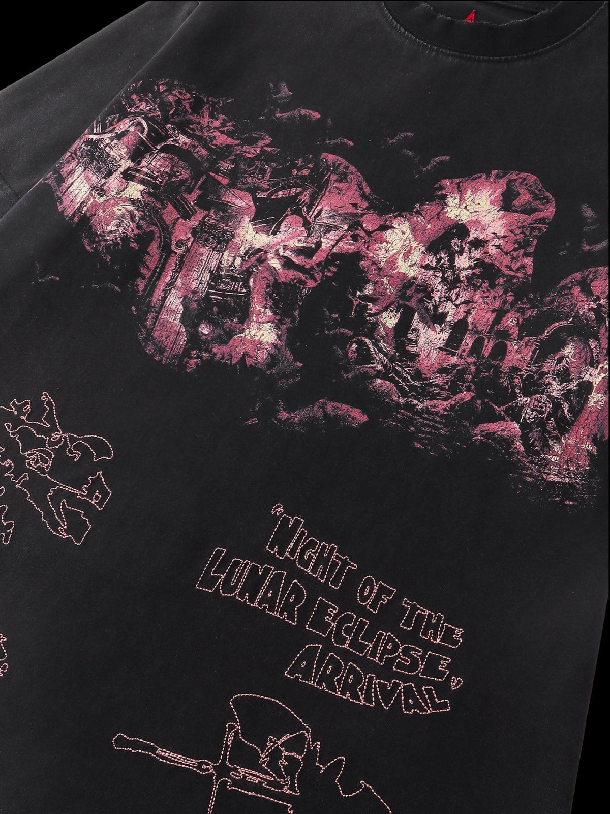 Close-up of the washed distressed print on TBHNP black arrival tee — men's streetwear detail
