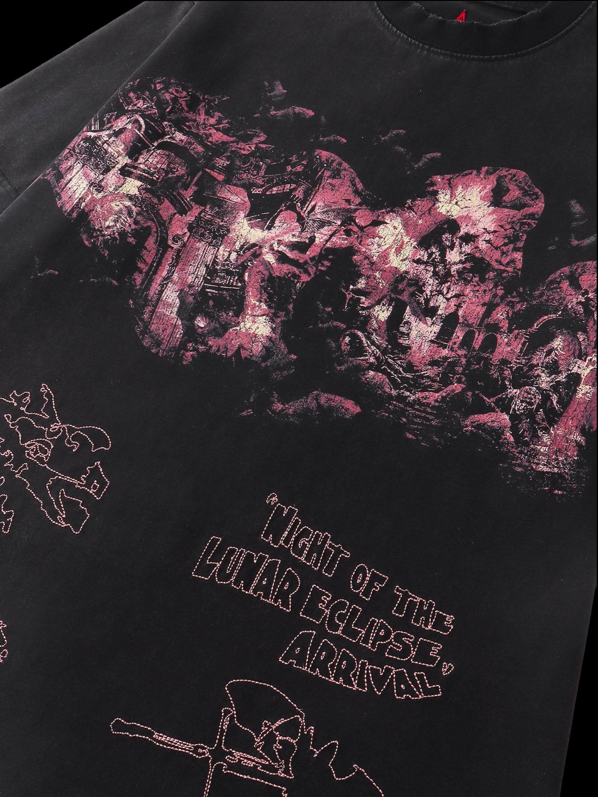 Close-up of the washed distressed print on TBHNP black arrival tee — men's streetwear detail