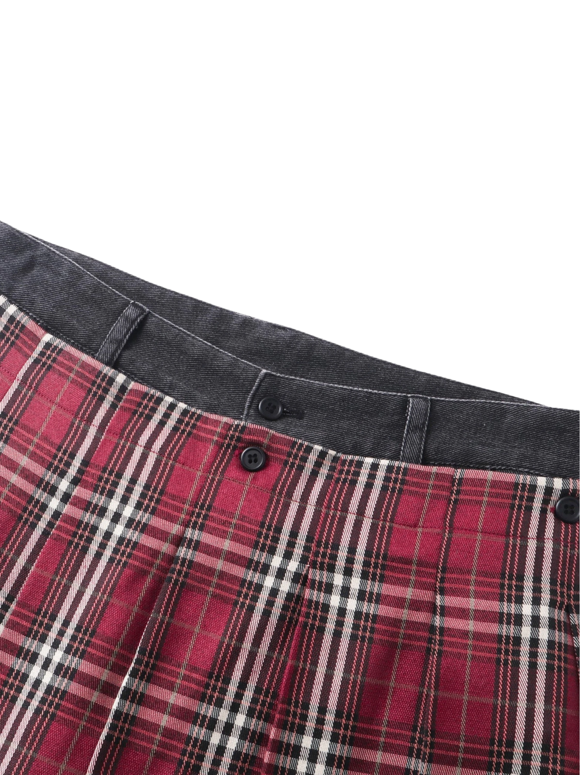 Close-up of the waistband with attached plaid mini-skirt on TBHNP trousers — men's streetwear detail