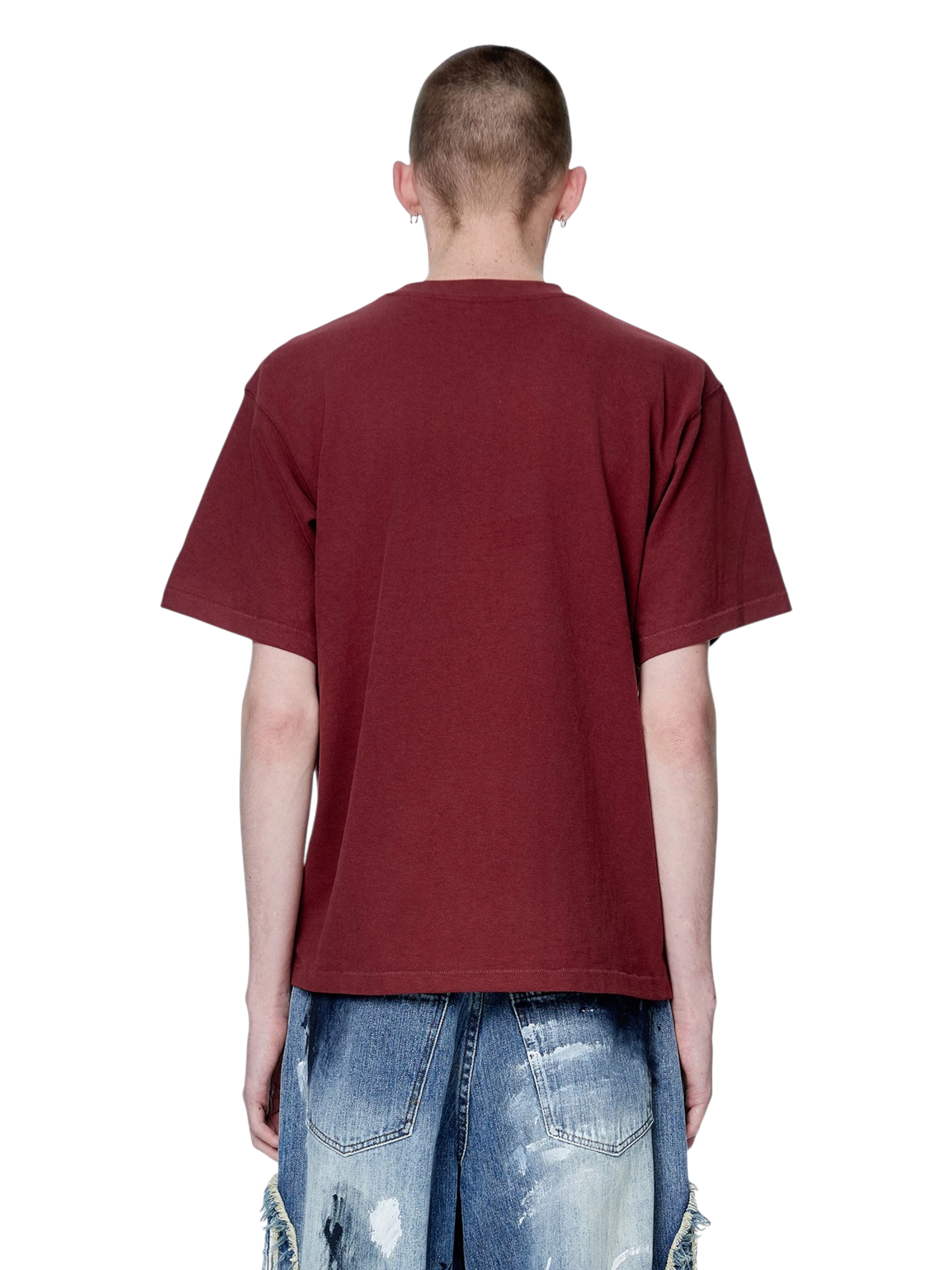 Model wearing TBHNP red Knight & Sword tee, back view — men's streetwear tee
