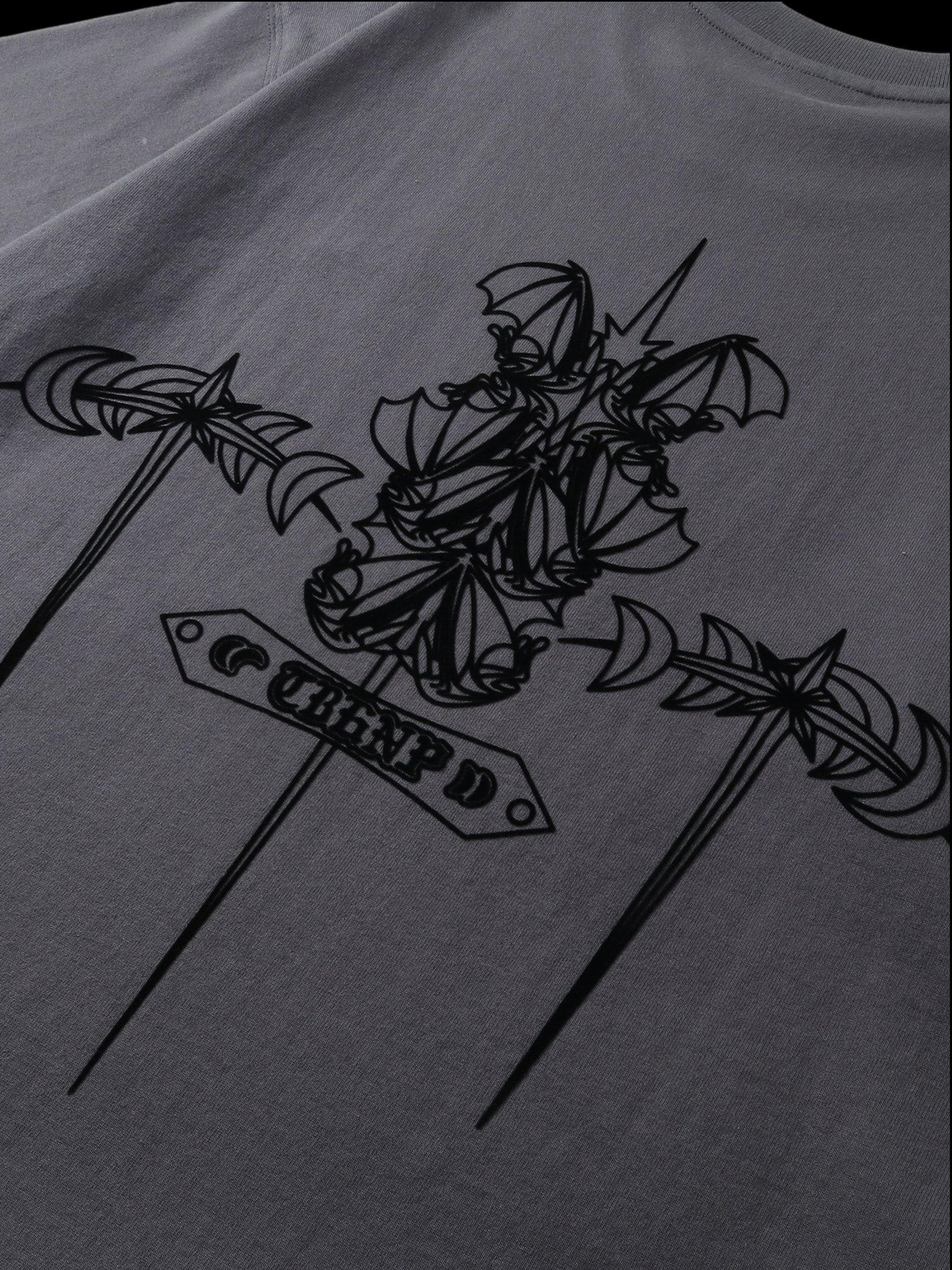 Close-up of the emblem and shadowbat print on TBHNP dark grey tee — men's streetwear detail