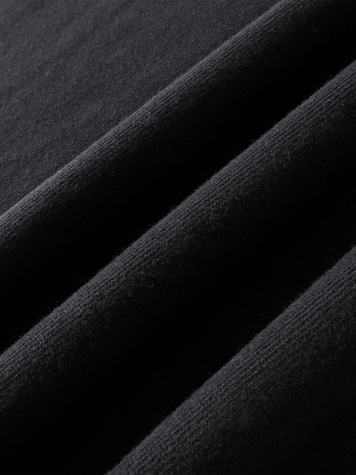 Close-up of the cotton texture on TBHNP dark grey Knight & Sword tee — men's streetwear detail