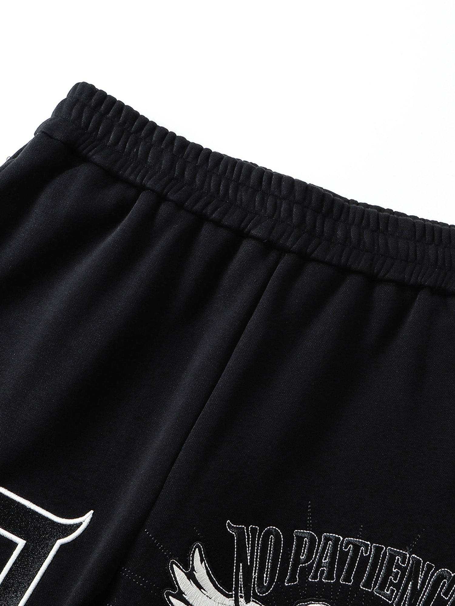 Black sweatpants elastic waistband and drawstring detail