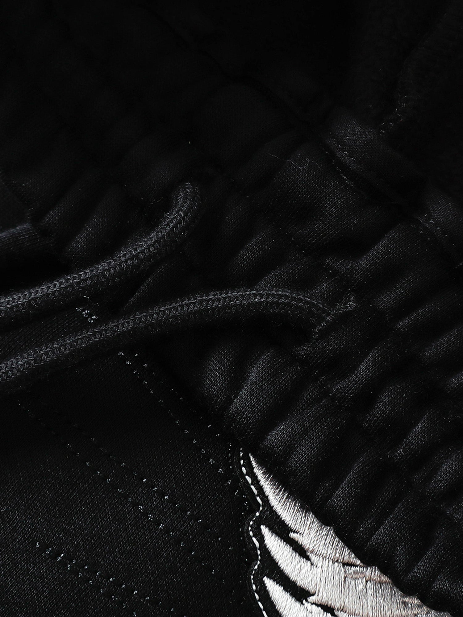 Black sweatpants pocket and reinforced seam detail