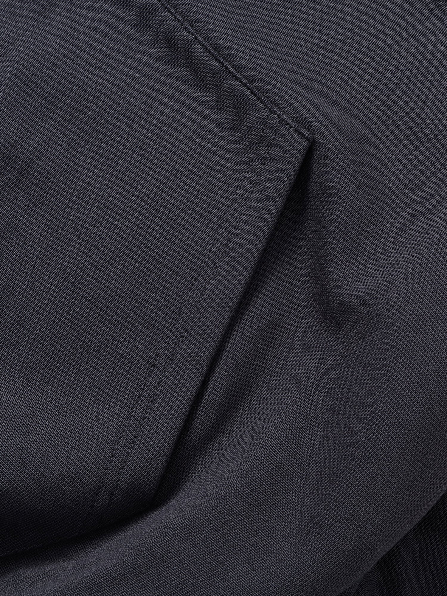 Close-up of the Black hoodie cuff and cotton texture.