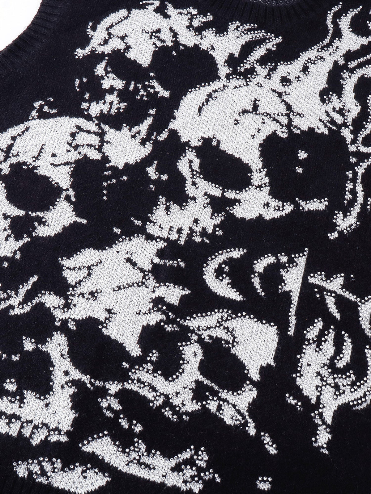 Close-up of the jacquard wraith motif and rhinestone detailing.