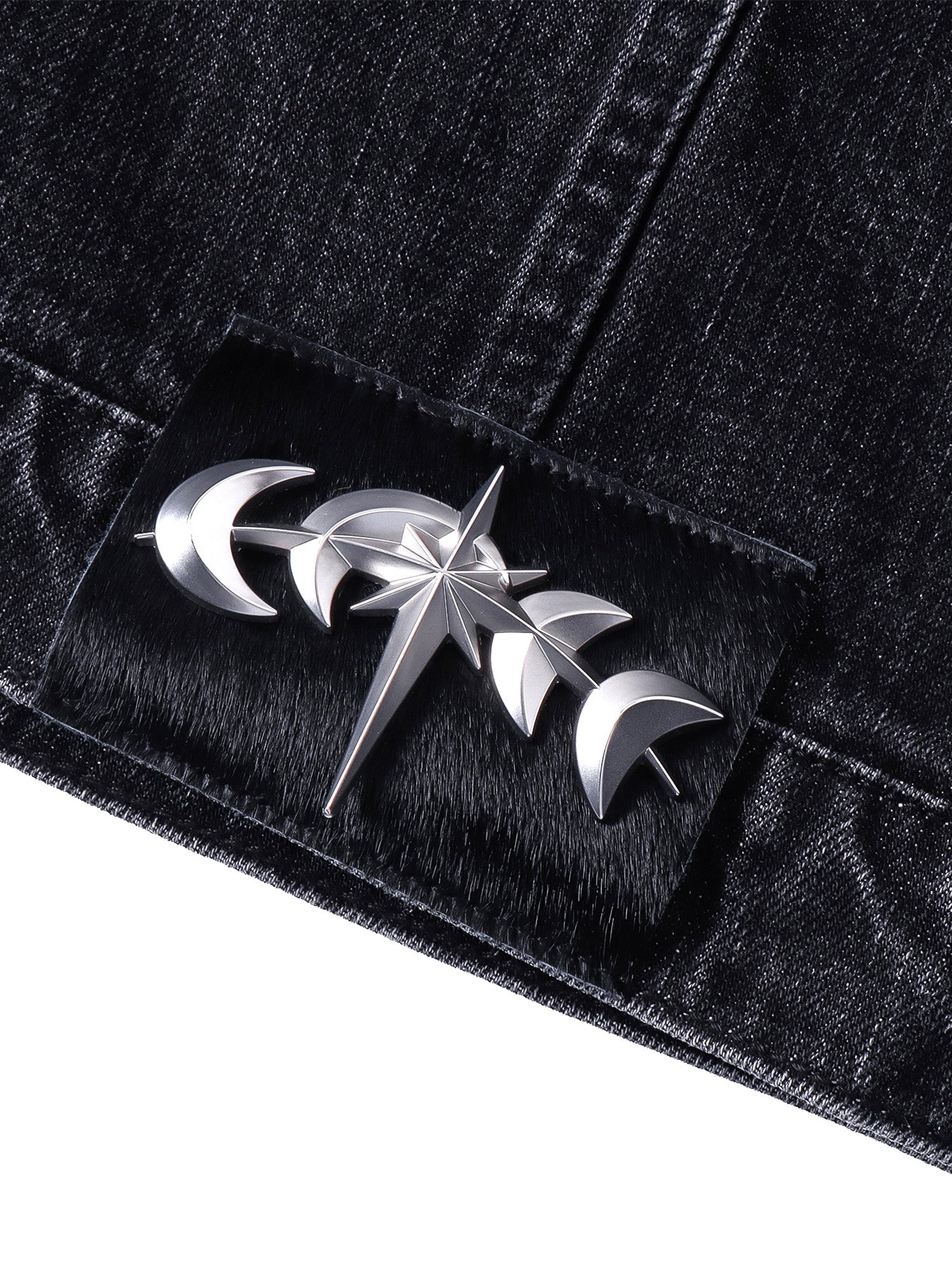 TBHNP T260016 black denim jacket, star-and-crescent hardware at the back hem.