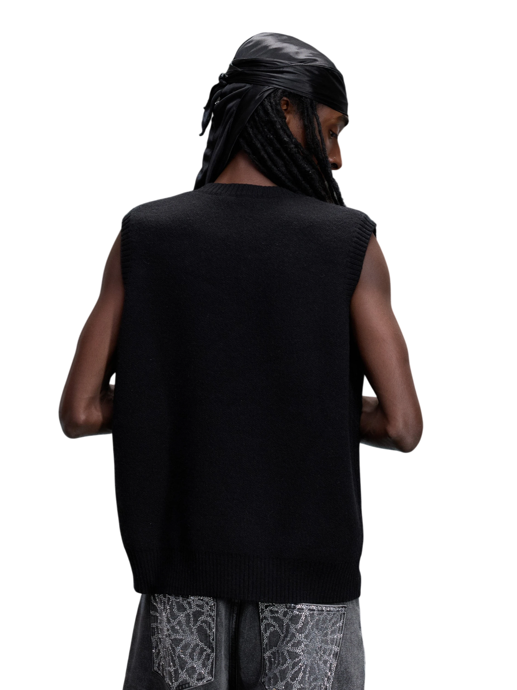 Model wearing the black Wraith Rhinestone Sweater Vest, back view.
