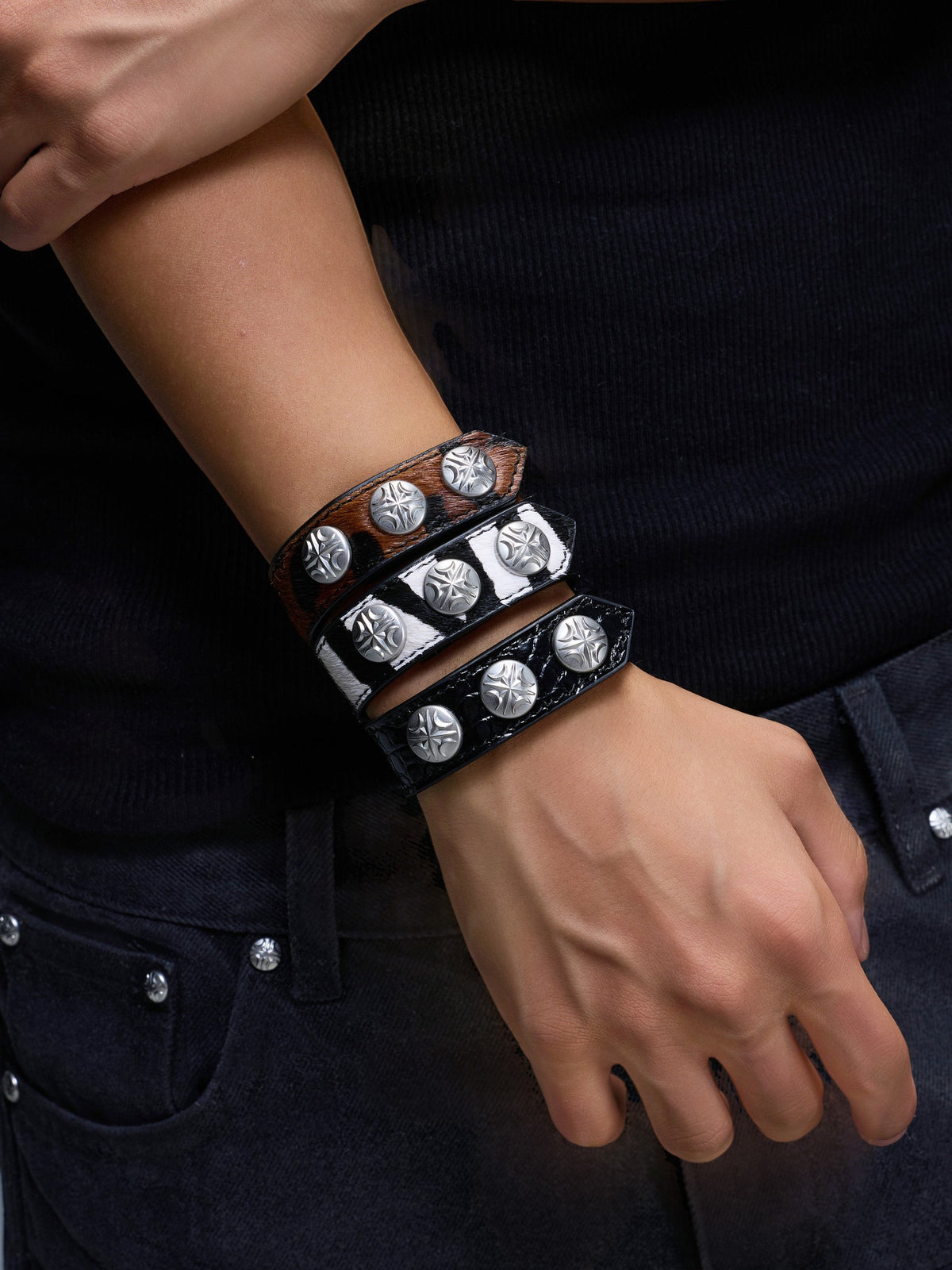 Leopard, Black, and Zebra leather bracelets stacked together.