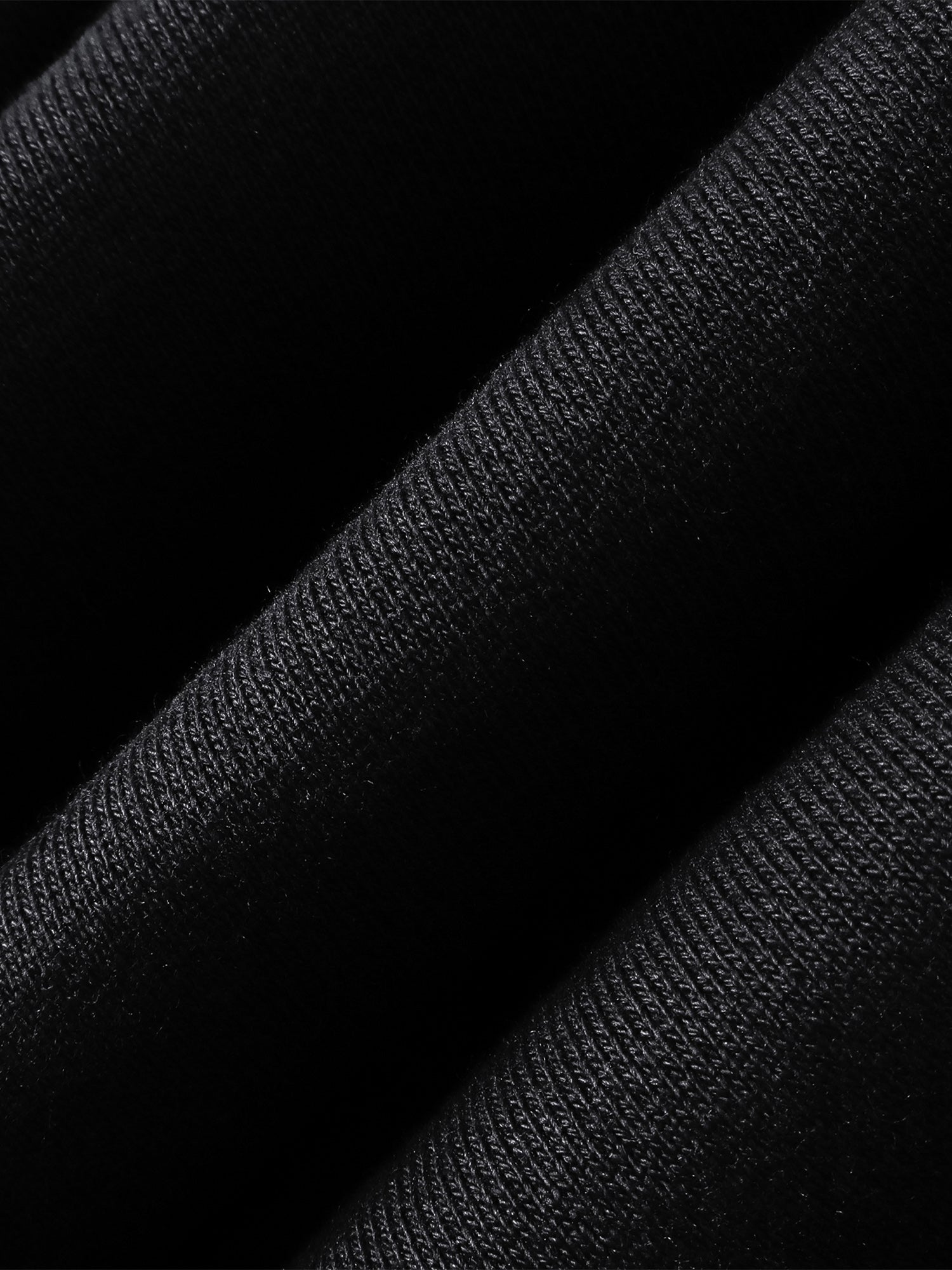 Close-up of the Grey Blue pants embroidered leather panel.