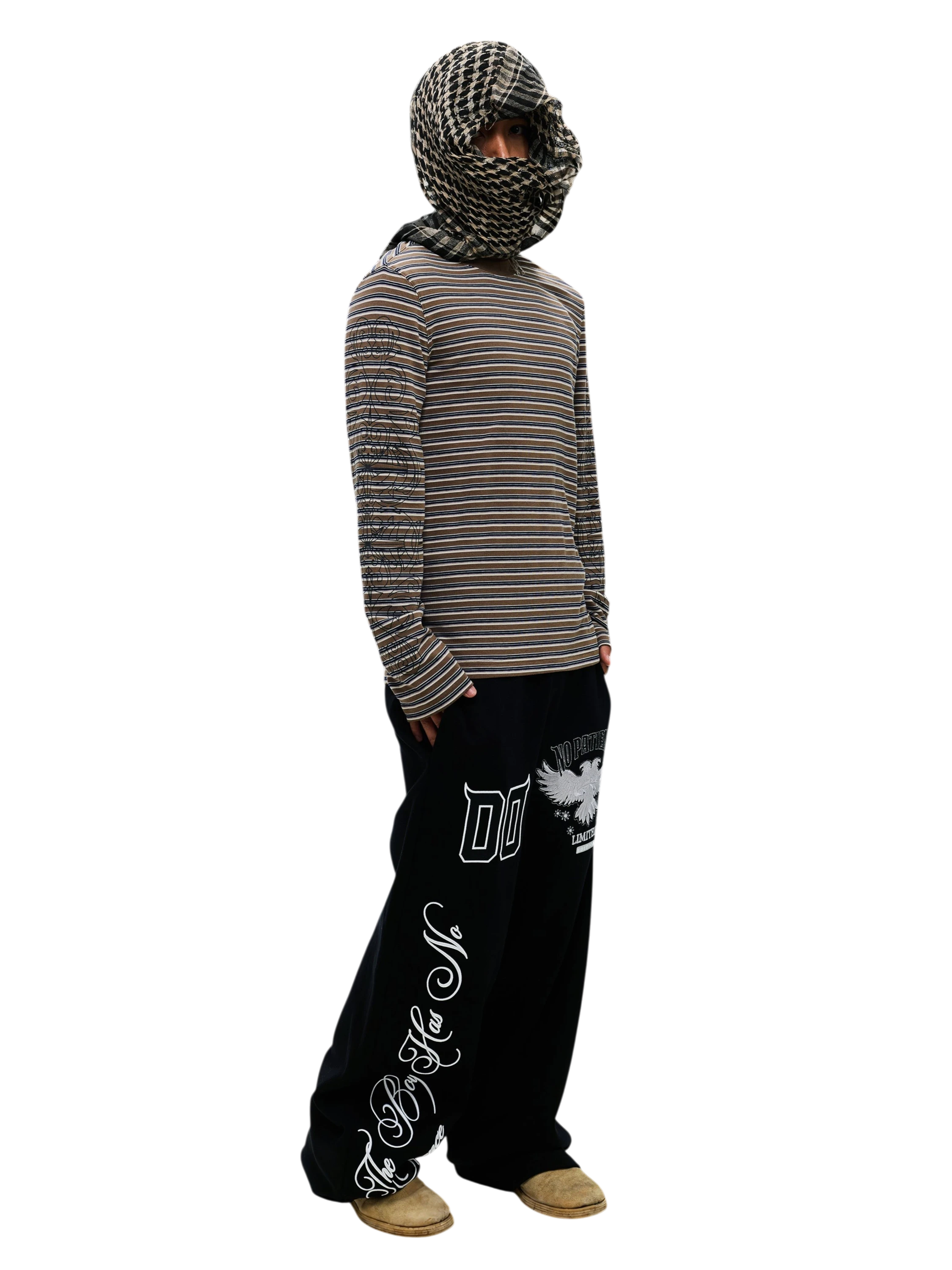Model wearing the Black Luminous Dawn striped long-sleeve tee