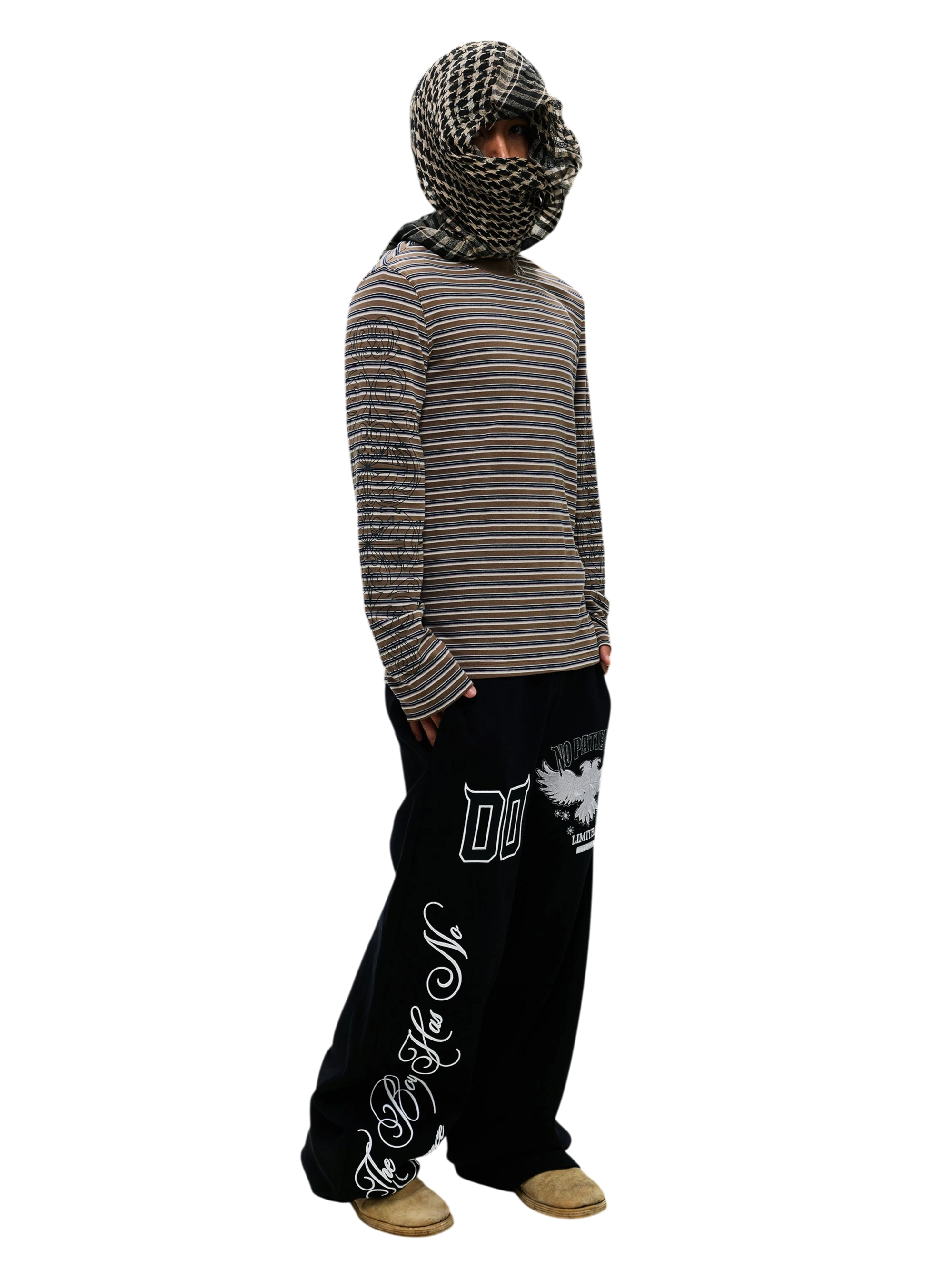 Model wearing the Black Luminous Dawn striped long-sleeve tee