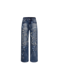 Vaqueros azules Luminous Dawn con lavado vintage, vista frontal con paneles desgastados y bordados de punto de cruz