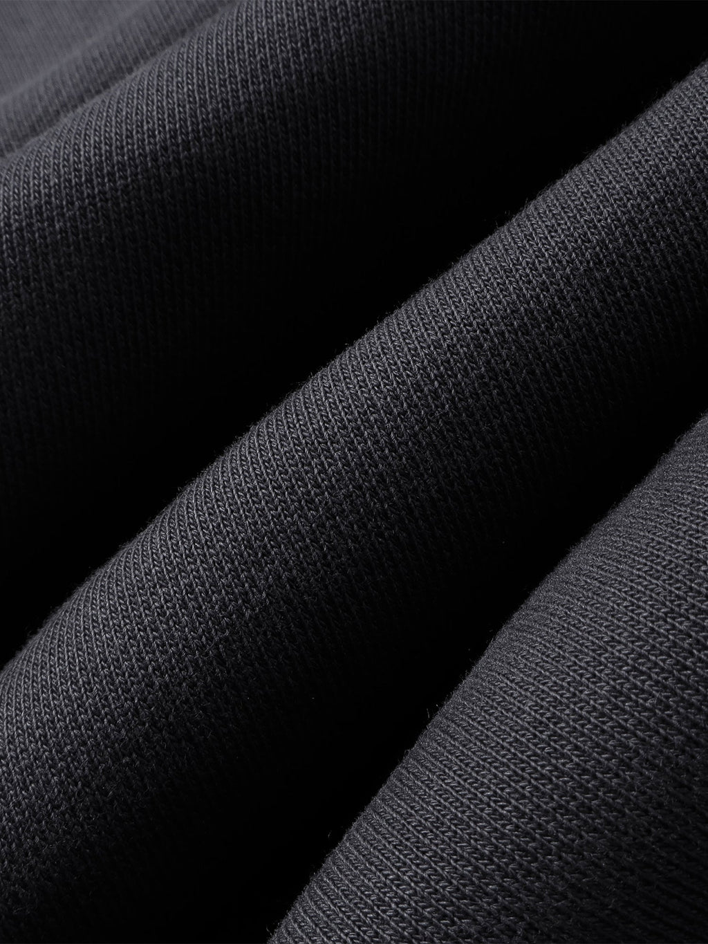 Close-up of the Black pants hem and straight-leg finish.