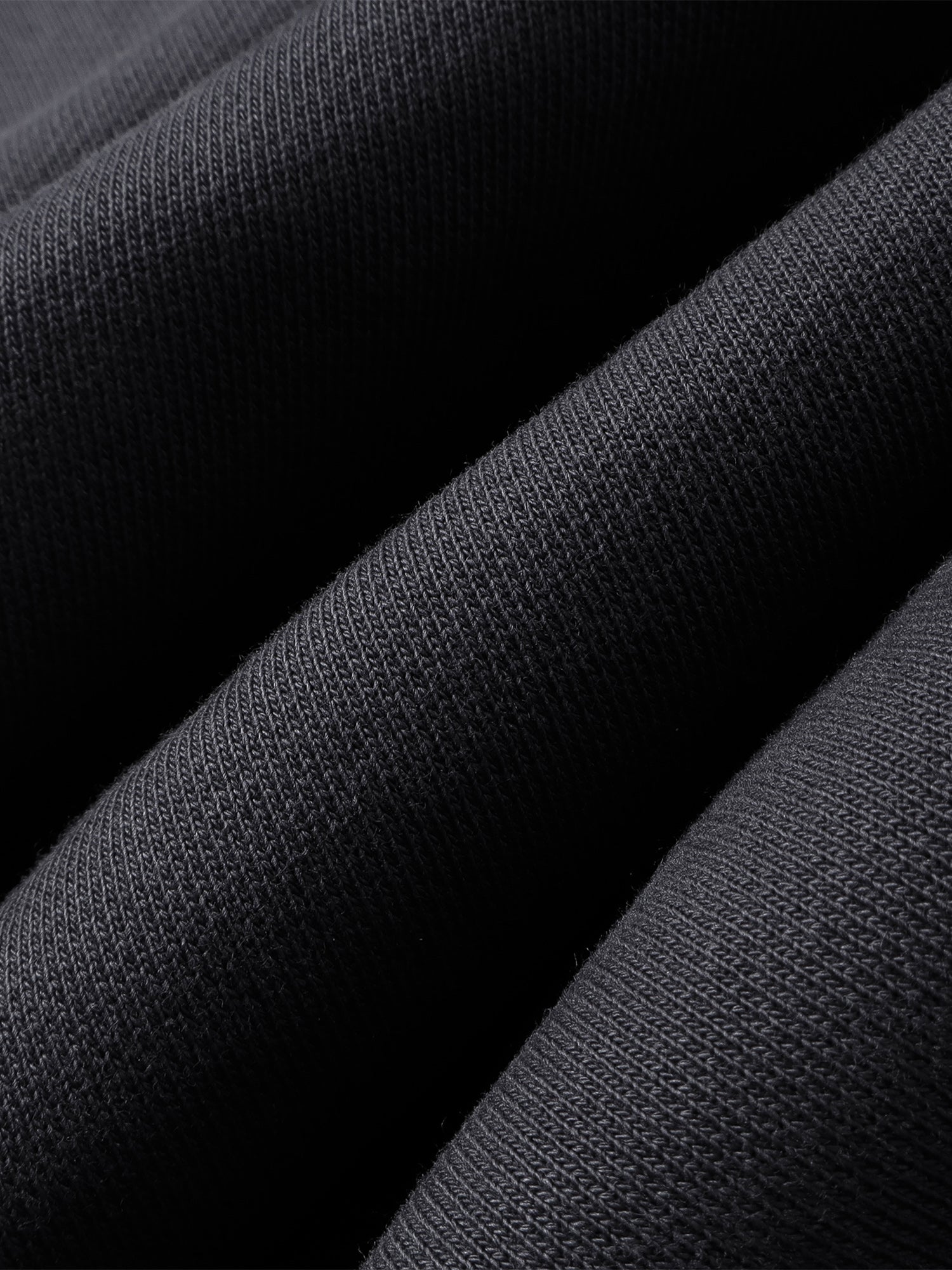 Close-up of the Black pants hem and straight-leg finish.