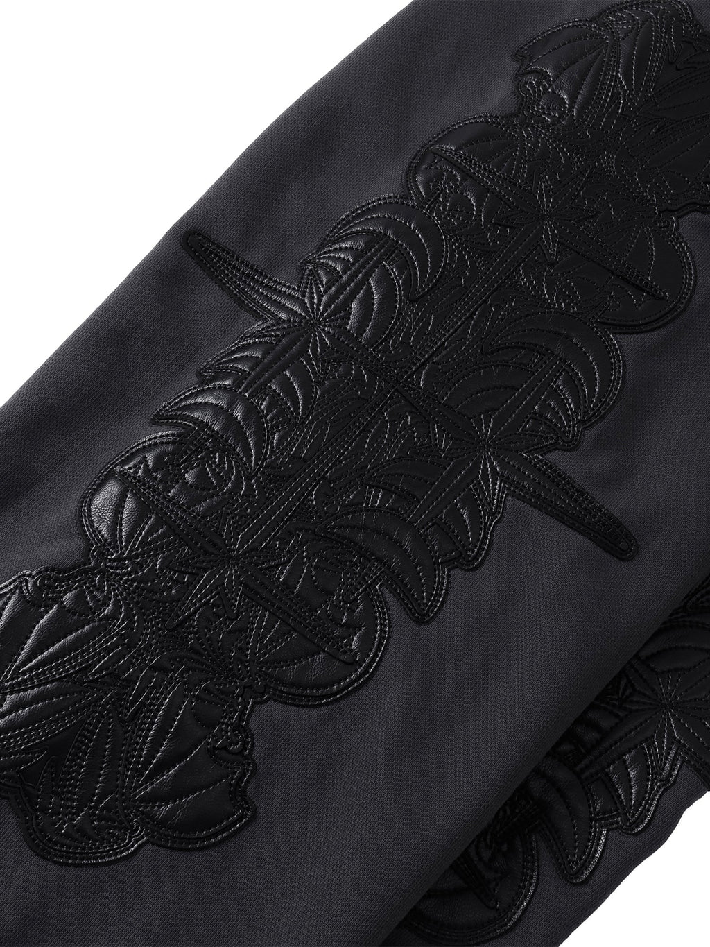 Close-up of the Black pants reinforced seams and leg panel.