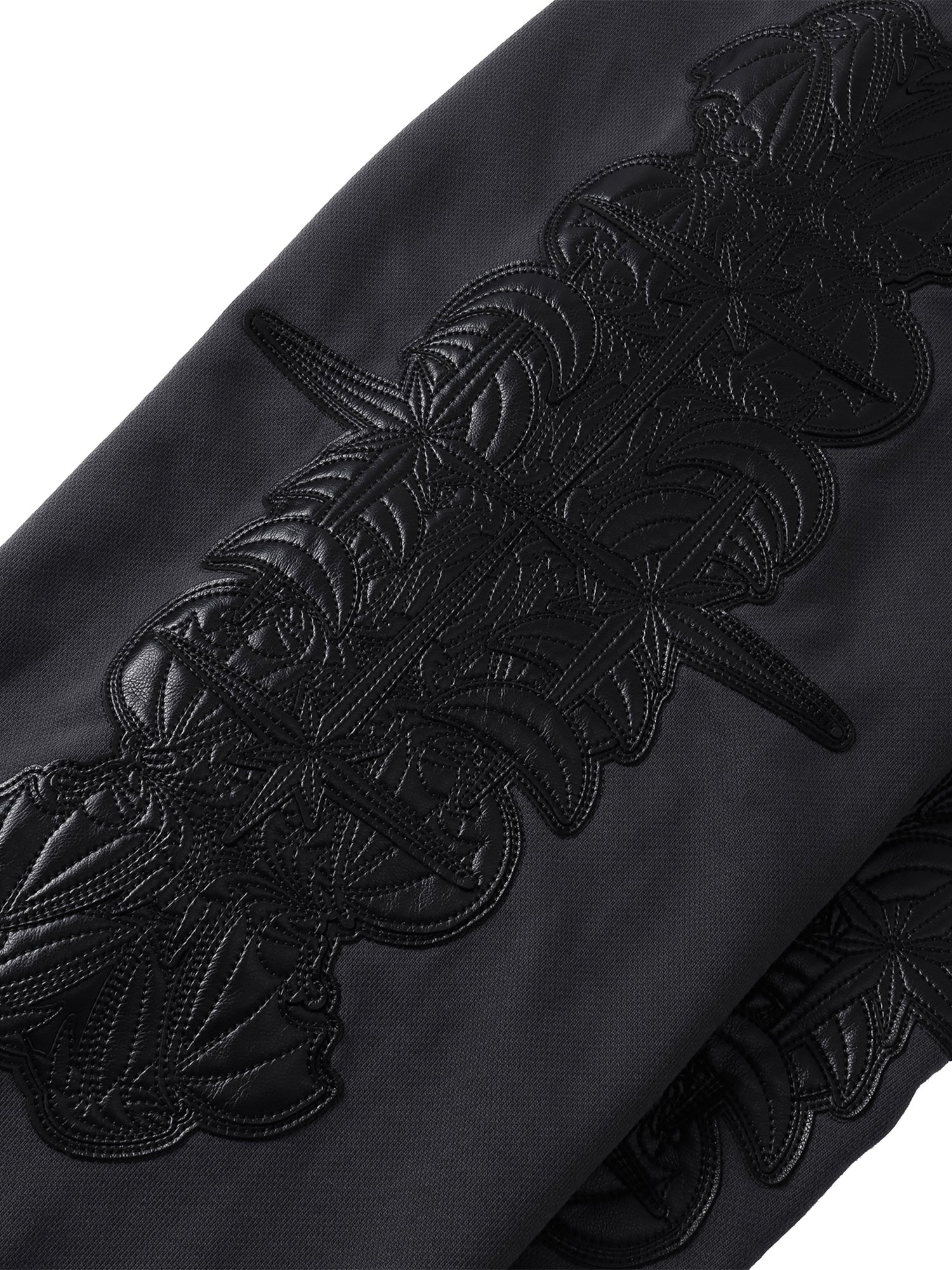 Close-up of the Black pants reinforced seams and leg panel.