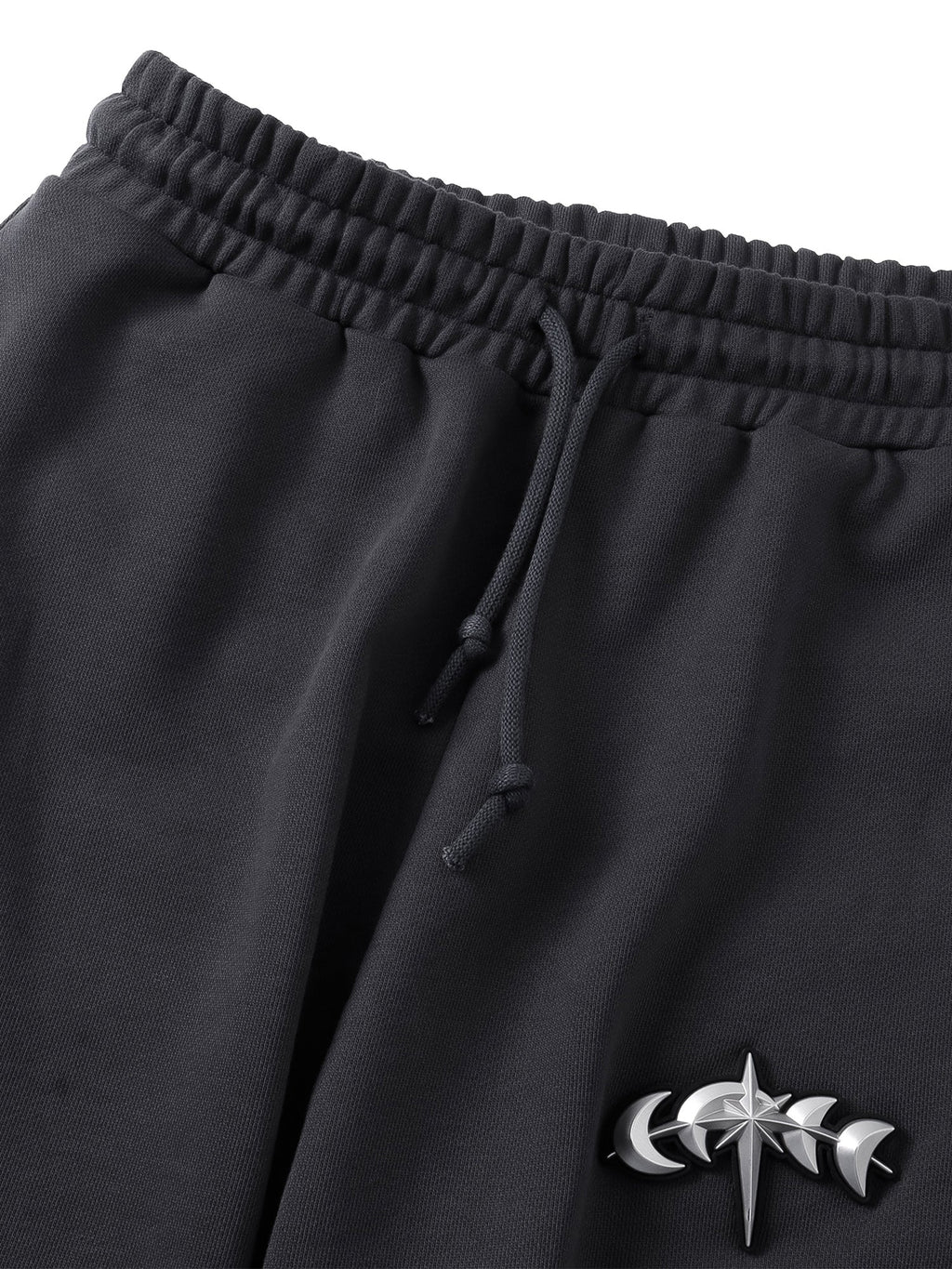 Close-up of the Black pants front construction and French terry texture.