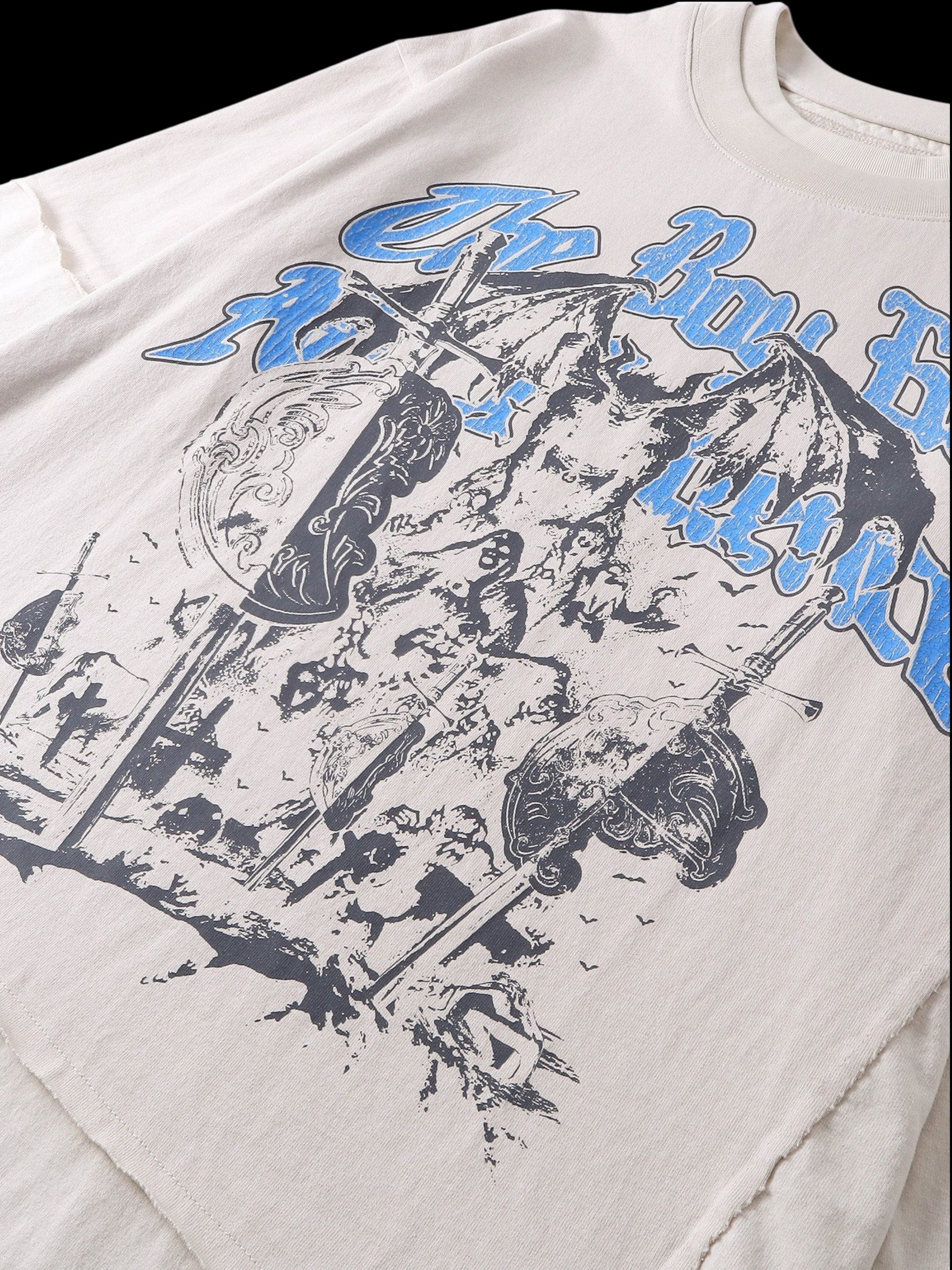 Close-up of the distressed cotton finish on TBHNP grayish-yellow knight tee — men's streetwear detail