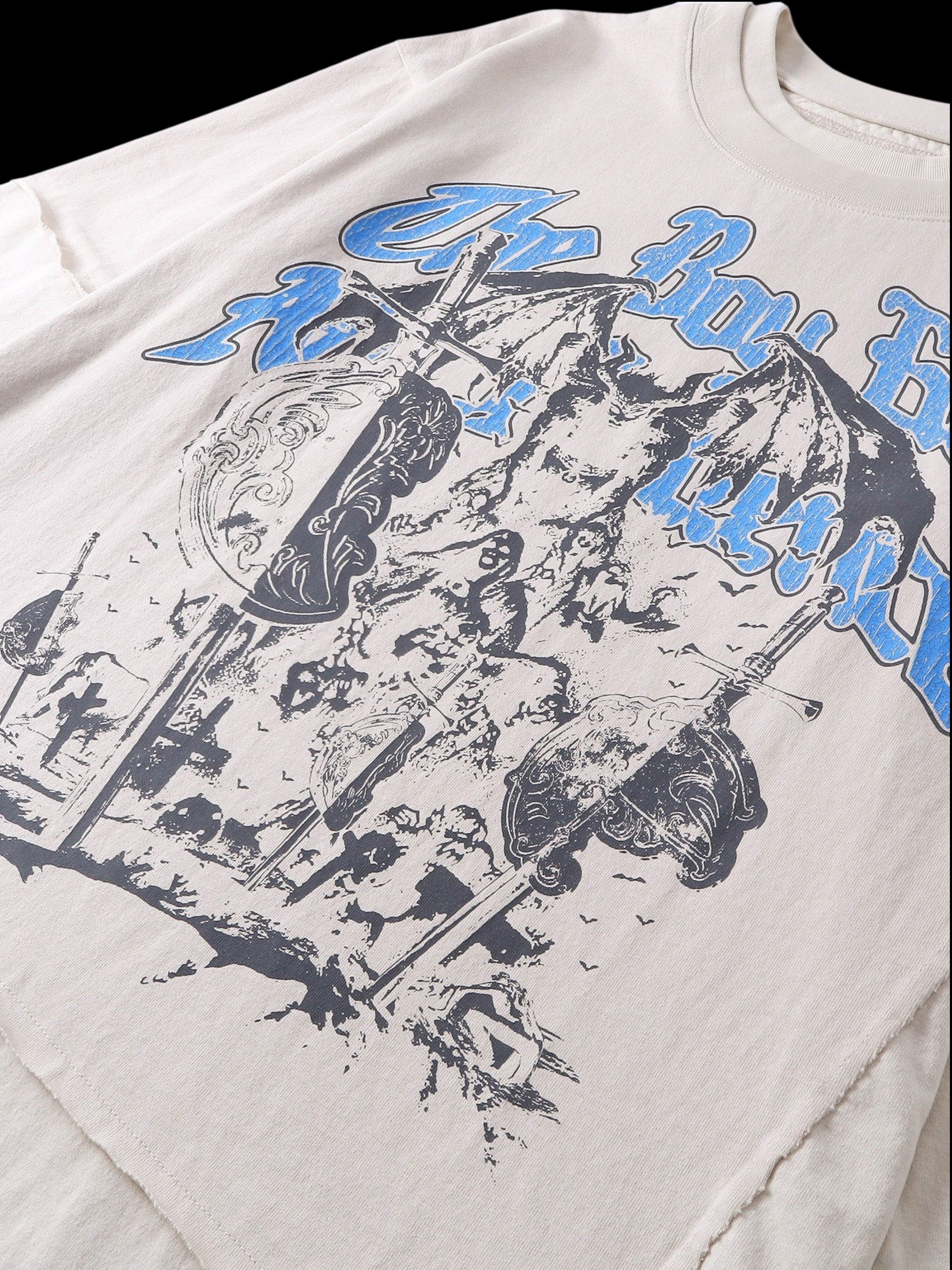 Close-up of the distressed cotton finish on TBHNP grayish-yellow knight tee — men's streetwear detail