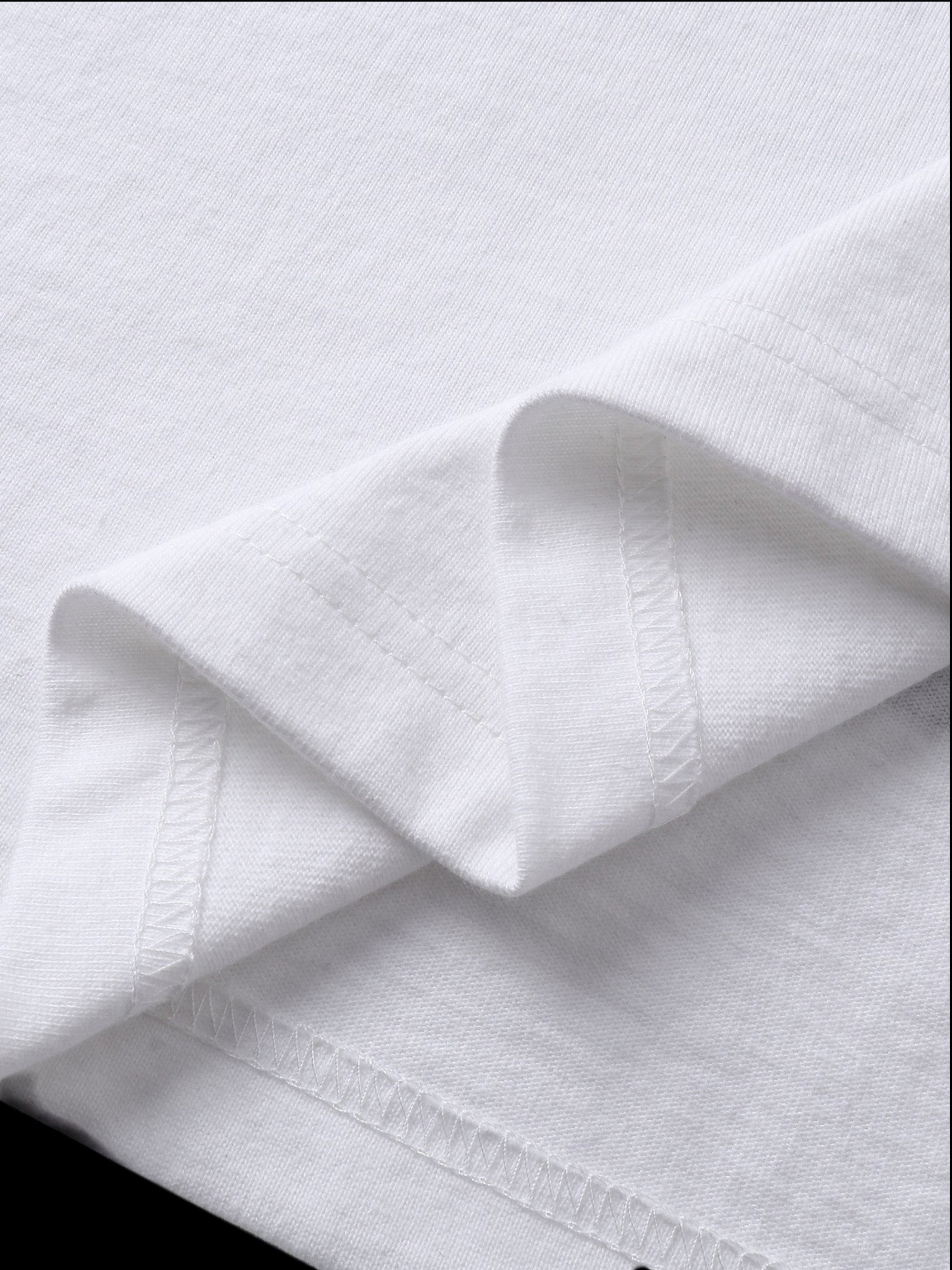 Close-up of the cotton texture on TBHNP white Shadowbat vest — men's streetwear detail