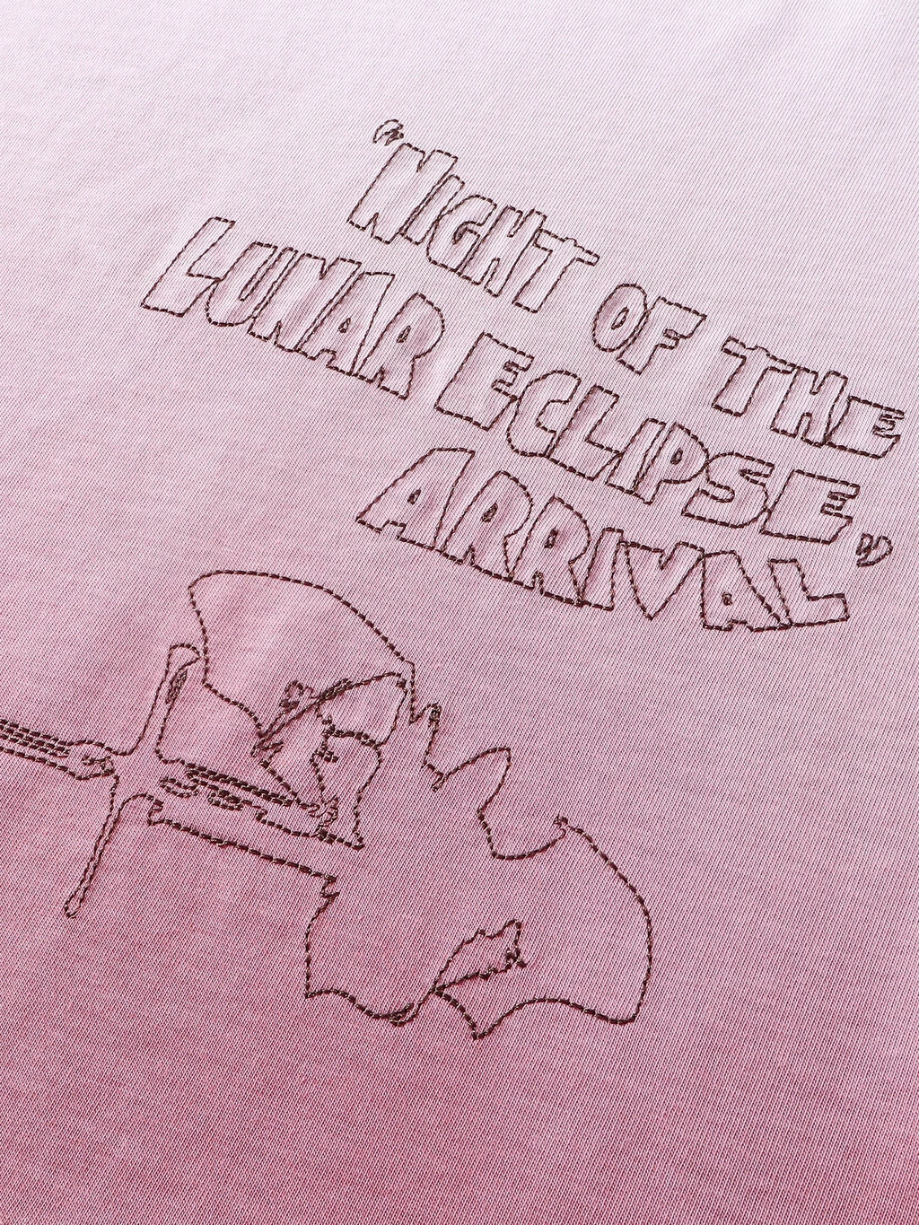 Close-up of the back graphic print on TBHNP white arrival tee — men's streetwear detail