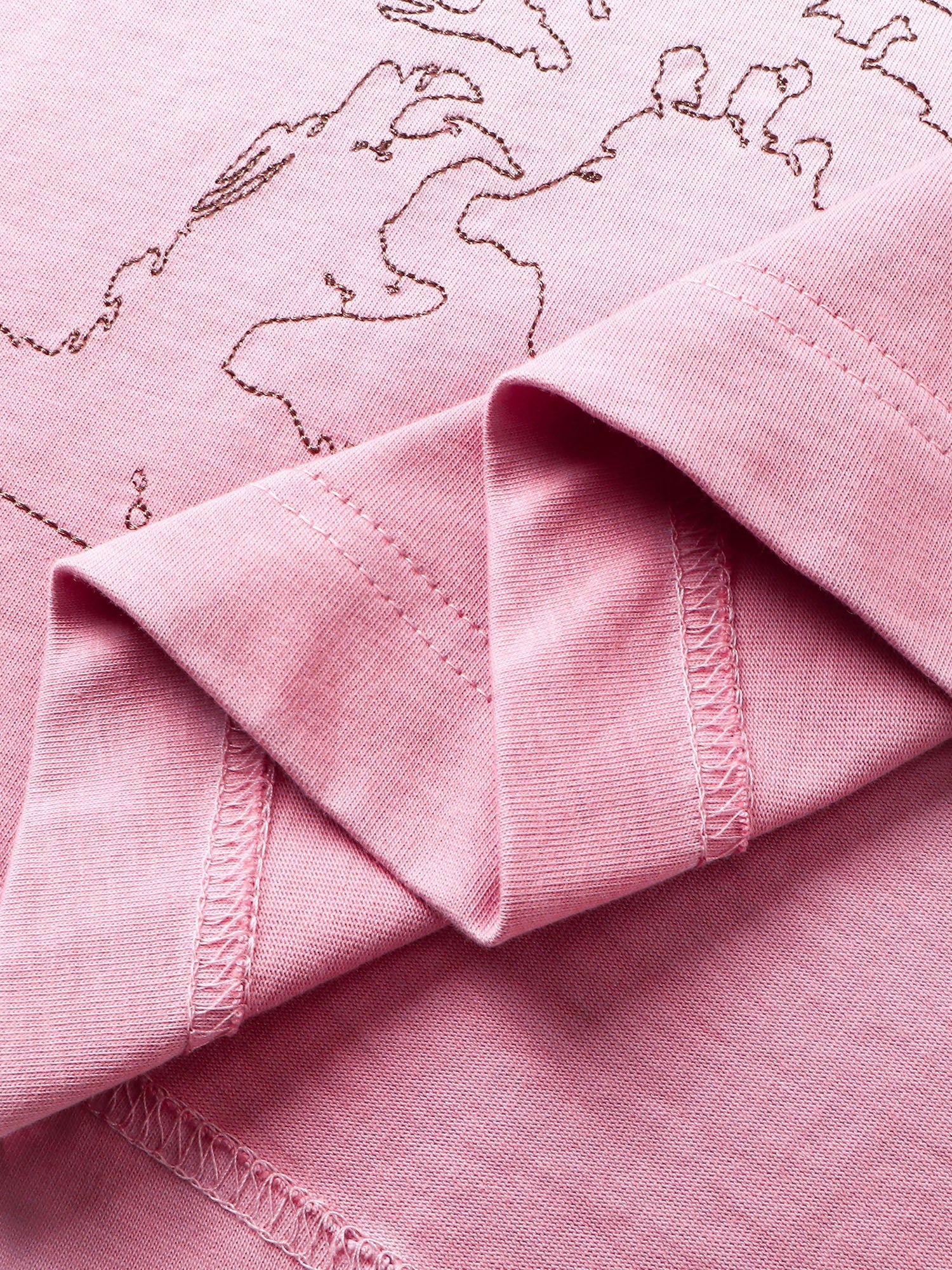 Close-up of the deconstructed sleeve hem on TBHNP white arrival tee — men's streetwear detail