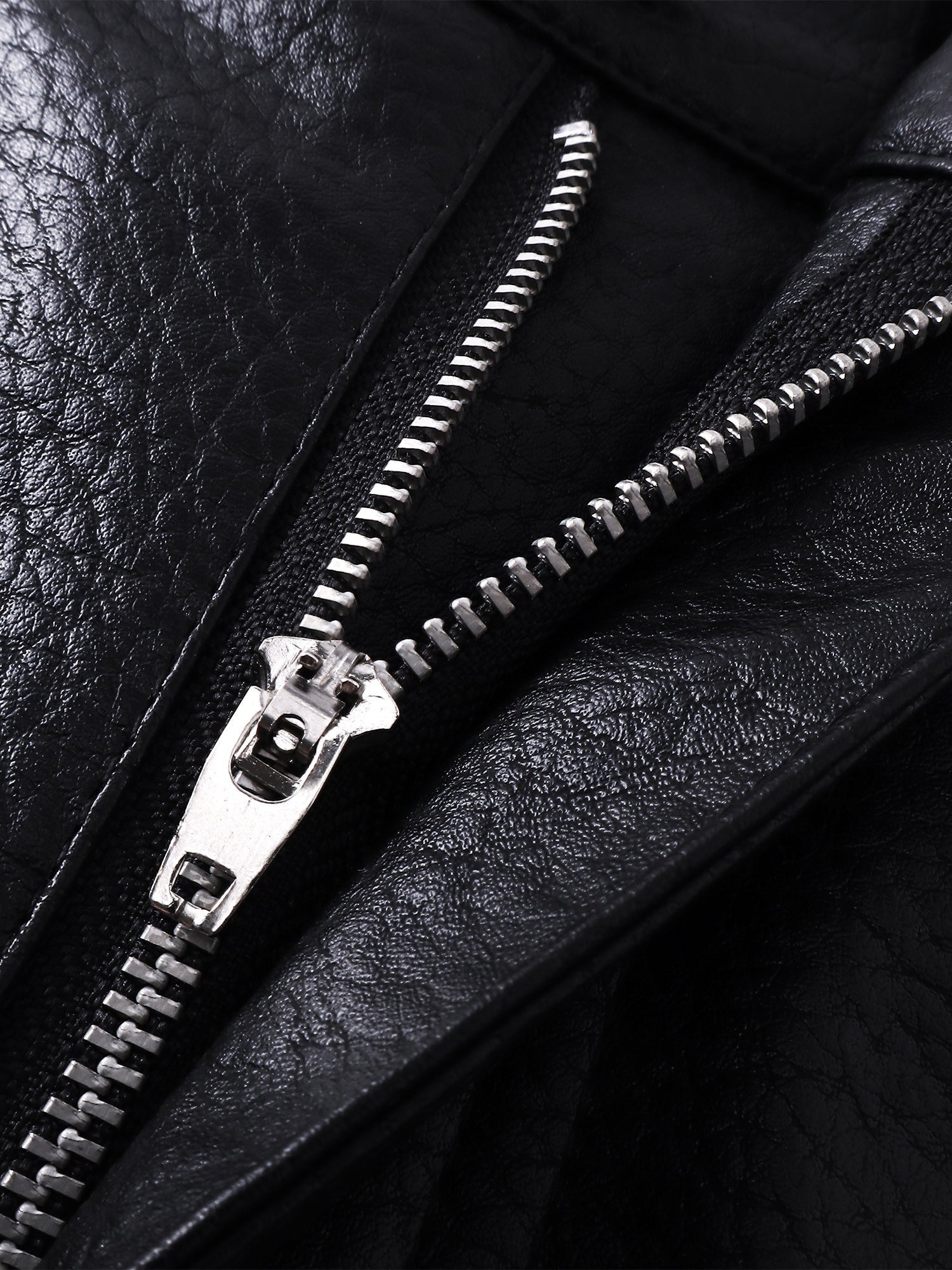 Close-up of the zip detail on TBHNP black faux-leather shorts — men's streetwear detail