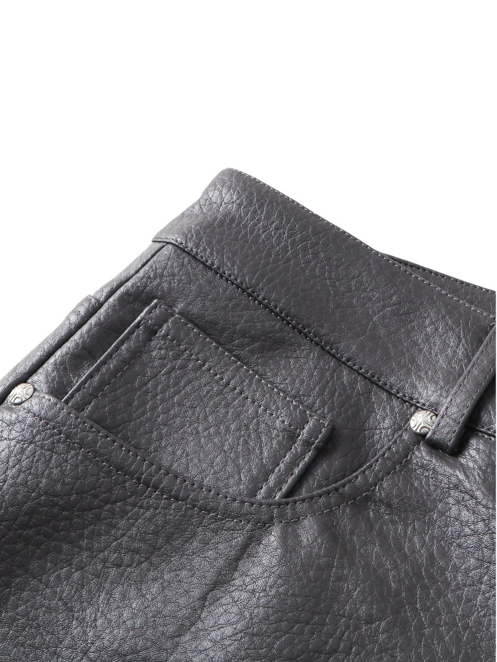 Close-up of the back pocket on TBHNP black faux-leather shorts — men's streetwear detail