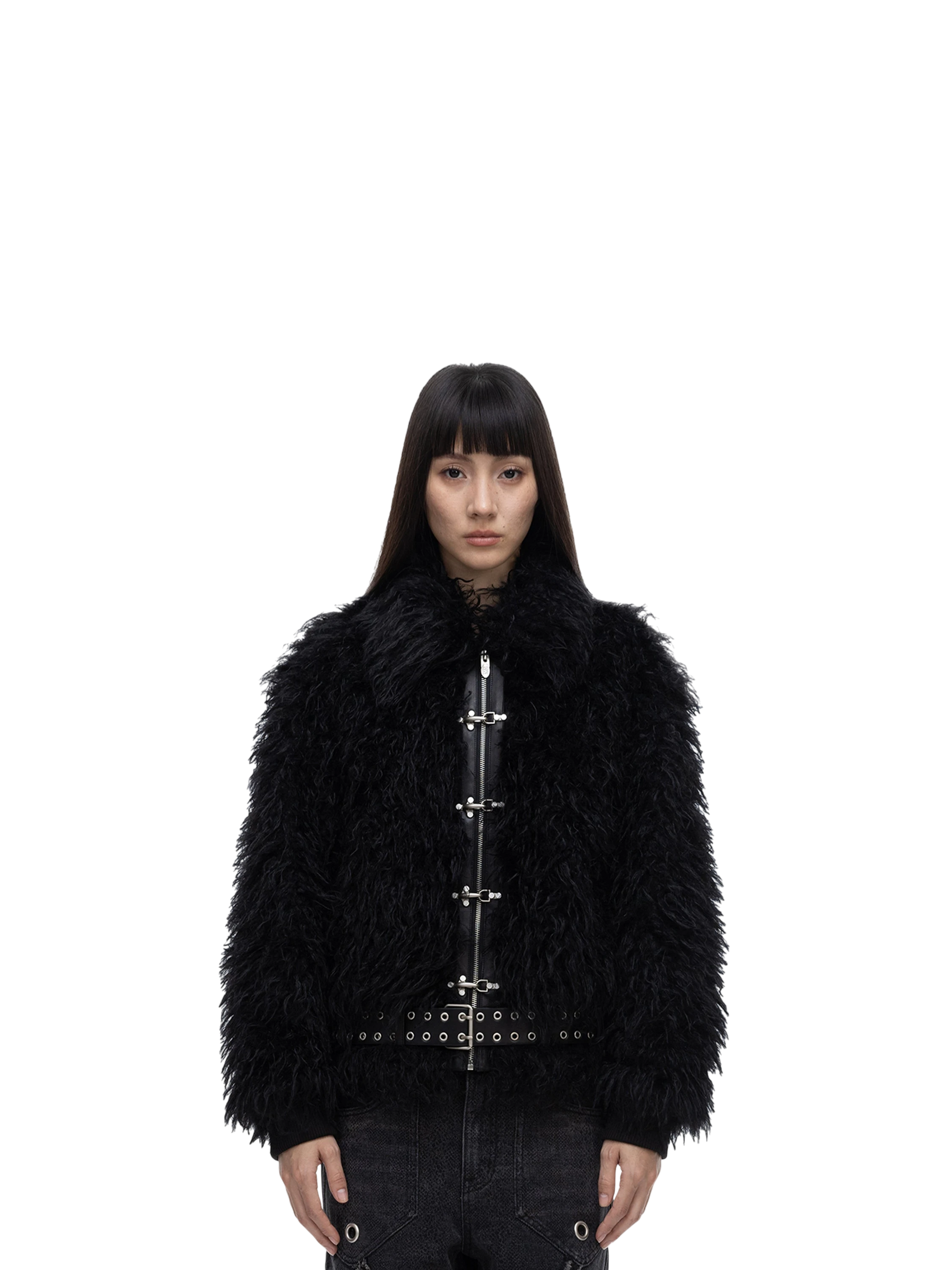 Female model wearing TBHNP black faux-fur bomber jacket, front — men's streetwear