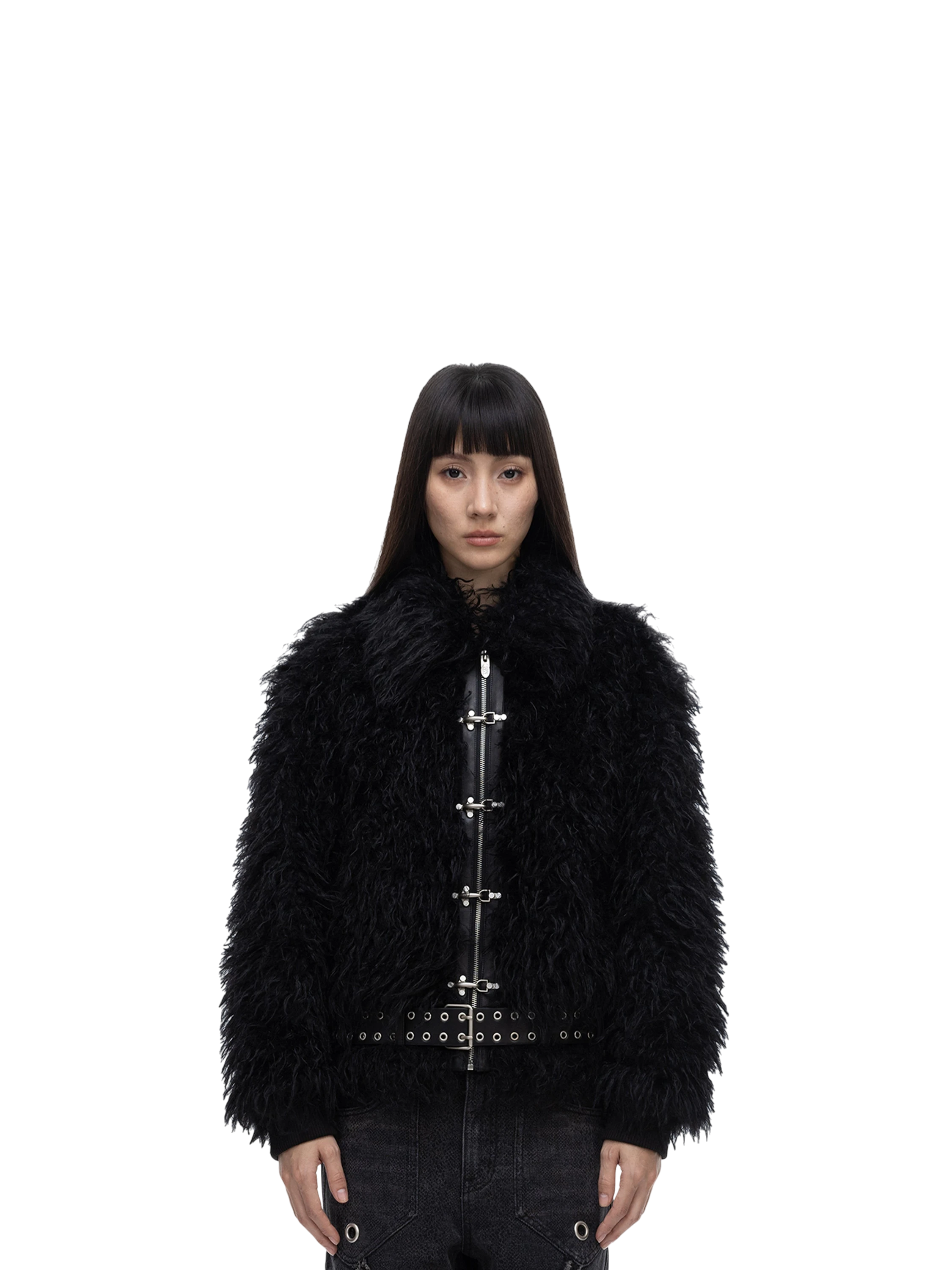 Female model wearing TBHNP black faux-fur bomber jacket, front — men's streetwear
