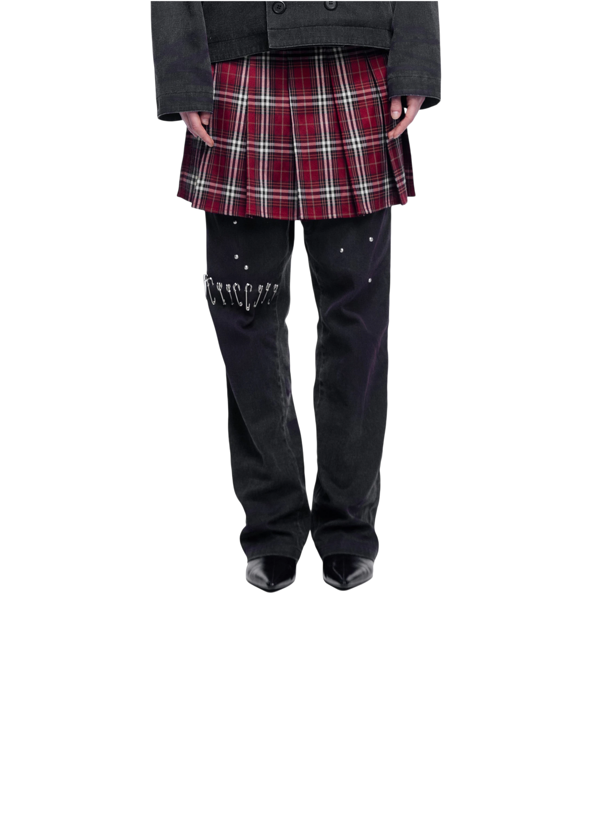 Model in TBHNP spray-washed trousers with plaid skirt, front lower-body — men's streetwear pants