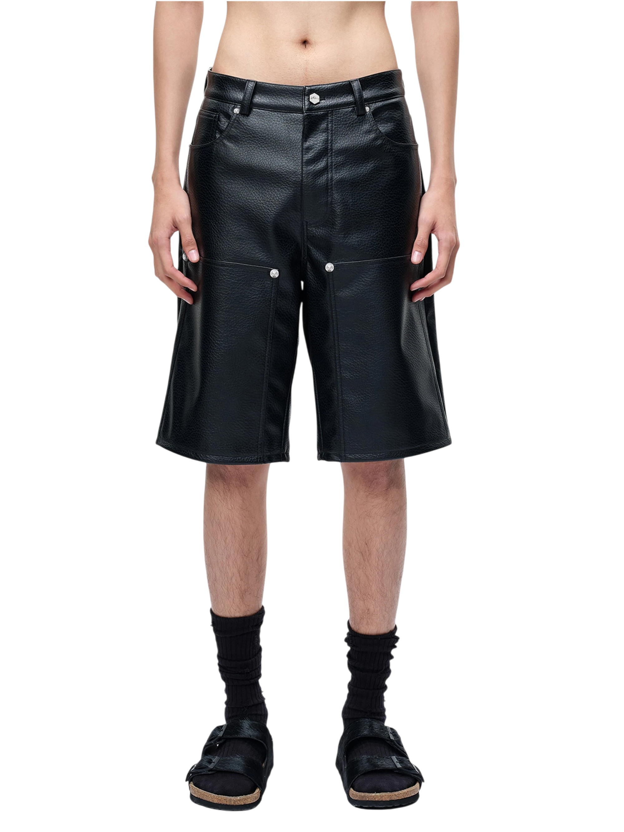 Model styling TBHNP black faux-leather wide-leg shorts, front — men's streetwear shorts
