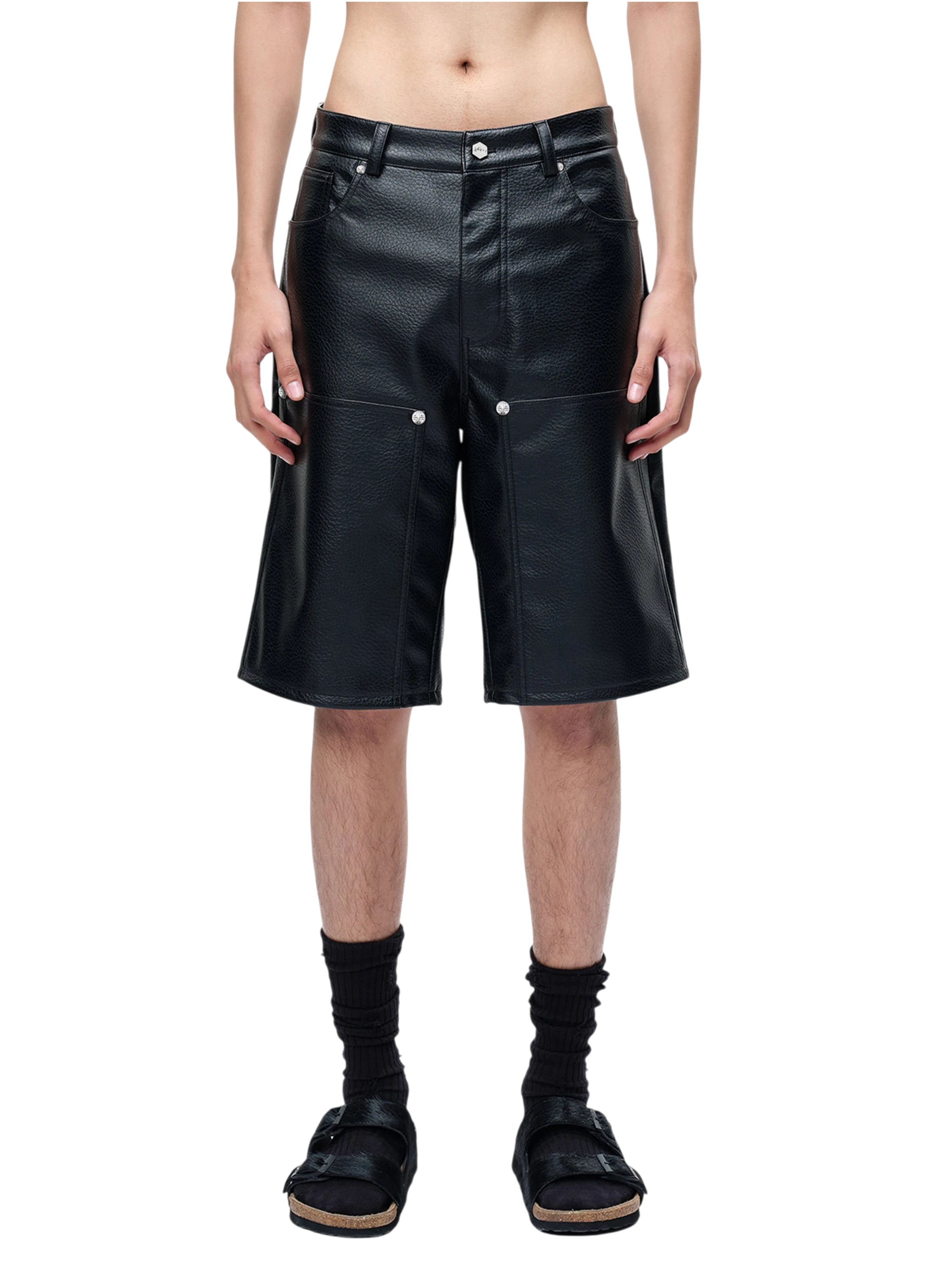 Model styling TBHNP black faux-leather wide-leg shorts, front — men's streetwear shorts