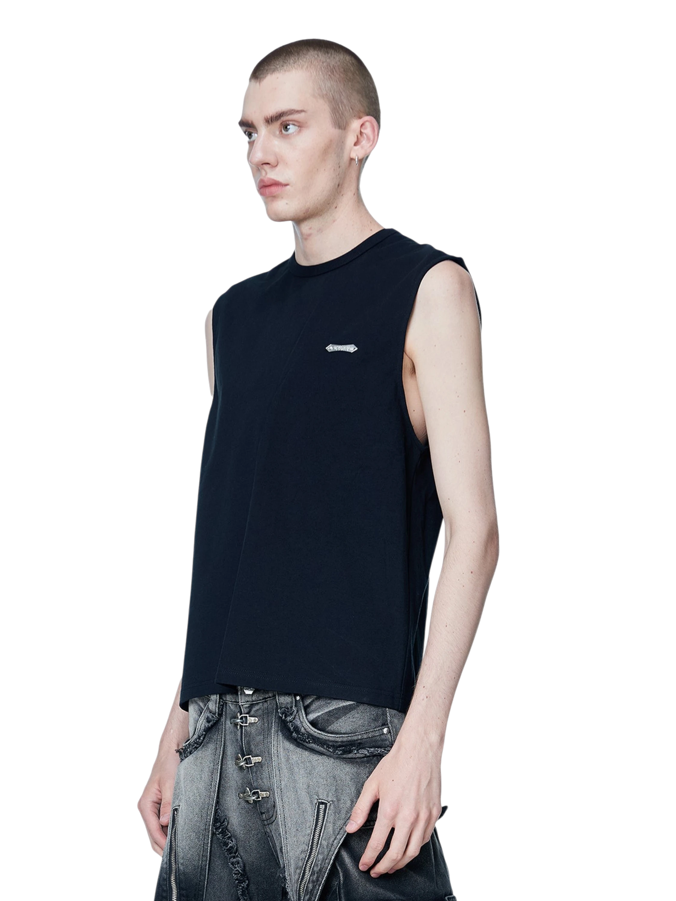Model styling TBHNP black Shadowbat vest, front detail — men's streetwear sleeveless tee