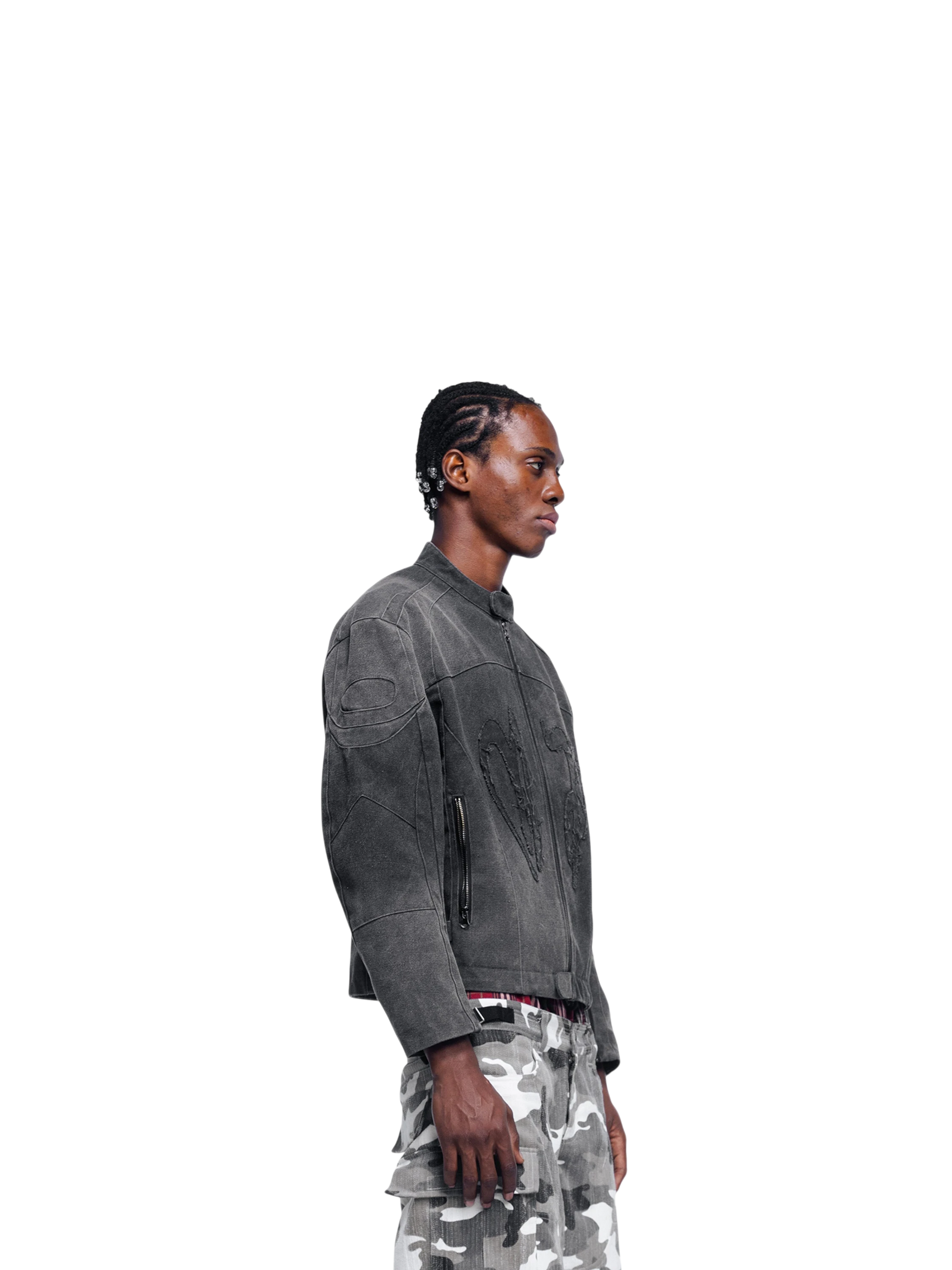 Male model in TBHNP Prince of Darkness canvas moto jacket, front walking — men's streetwear