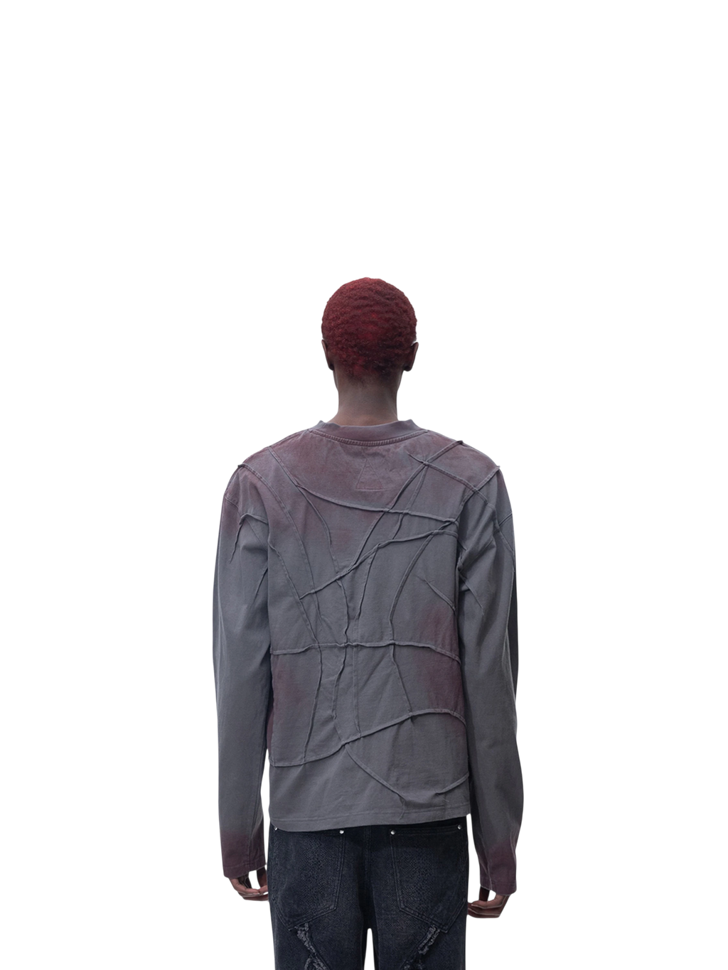 Model wearing TBHNP black sword-and-bone long-sleeve tee, back view — men's streetwear tee