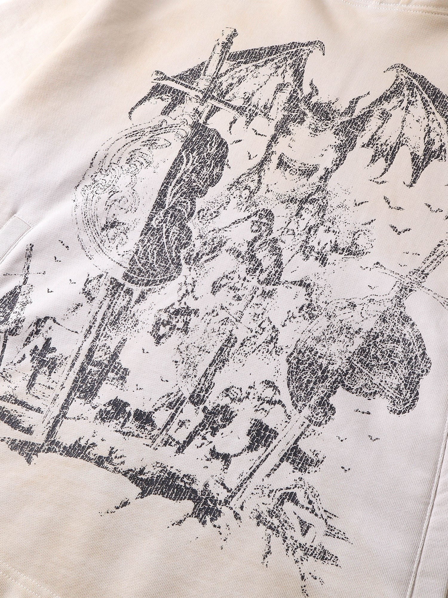 Close-up of the grey knight print on TBHNP grayish-yellow hoodie — men's streetwear detail